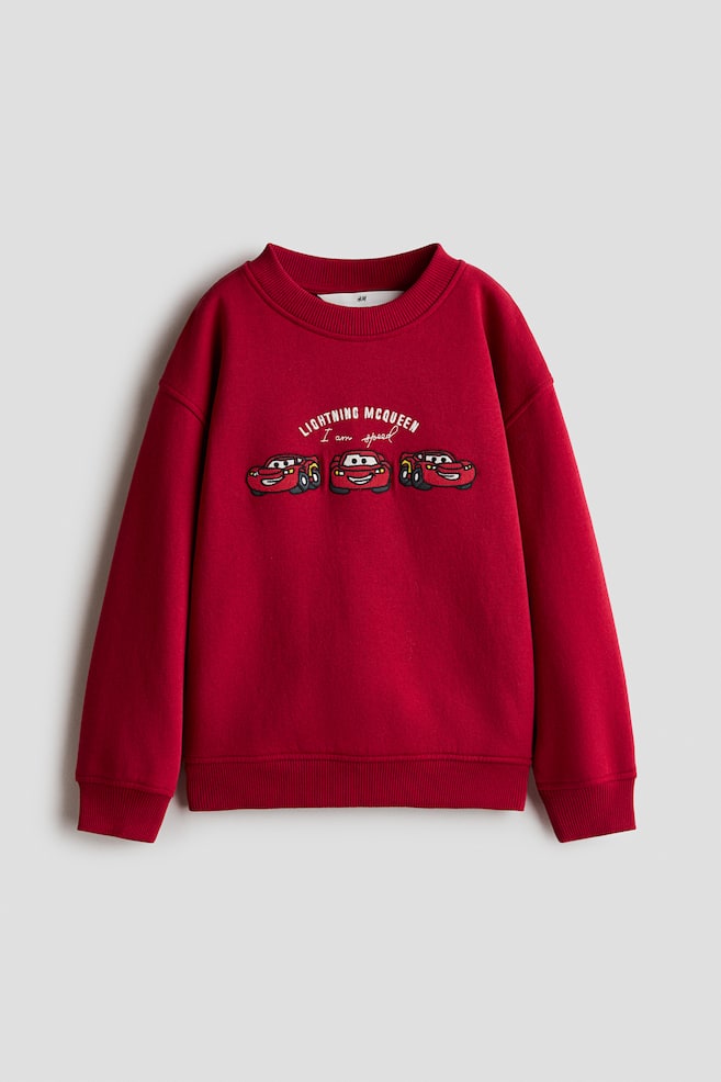 Sweatshirt mit Motivprint - Rot/Autos/Marineblau/Micky Maus/Dunkelgrau/Micky Maus/Cremefarben/Snoopy/Cremefarben/Super Mario/Braun/Jurassic World/Marineblau/Super Mario/Mattblau/Toy Story/Dunkelgrau/Sonic the Hedgehog - 1
