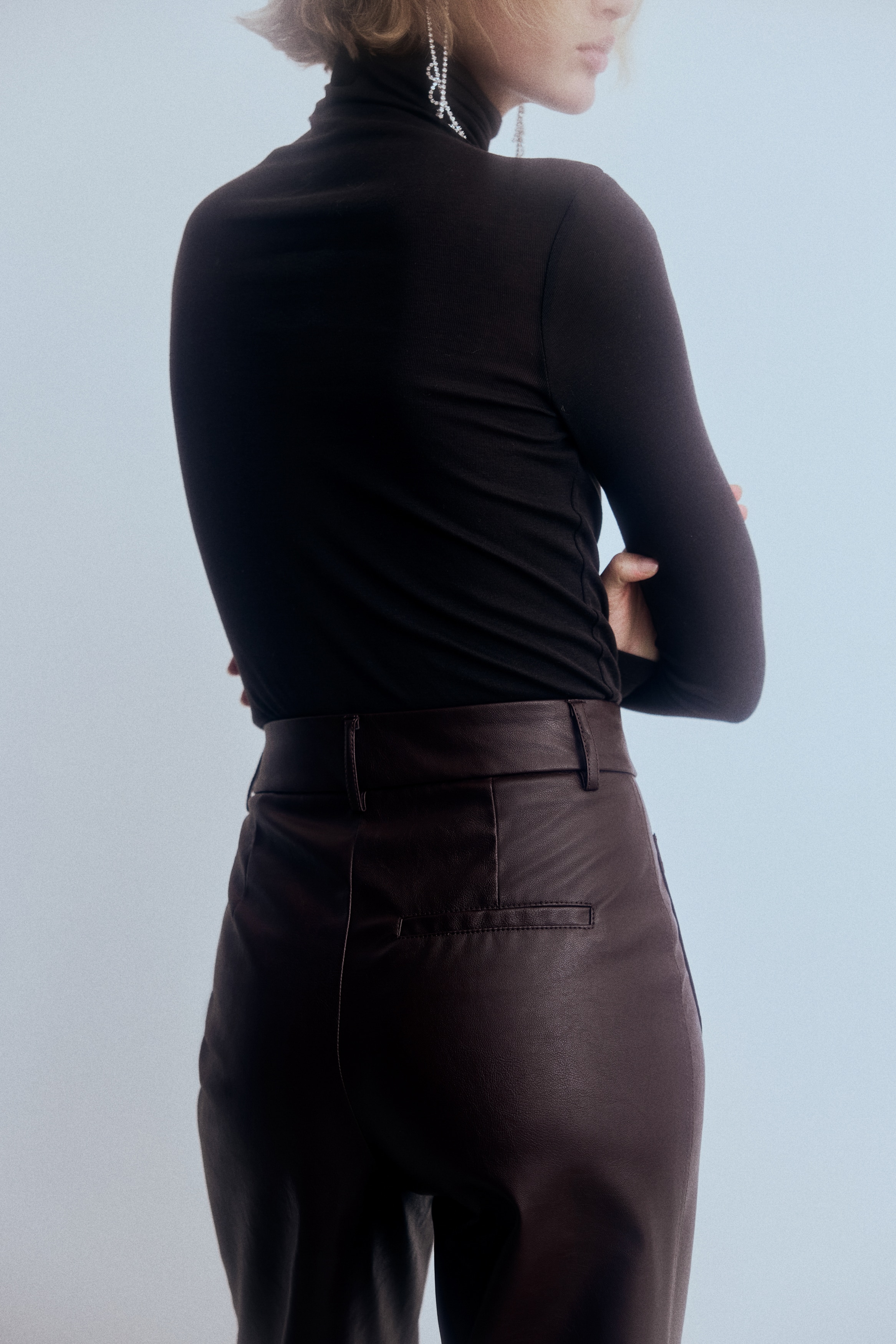 Flared coated trousers