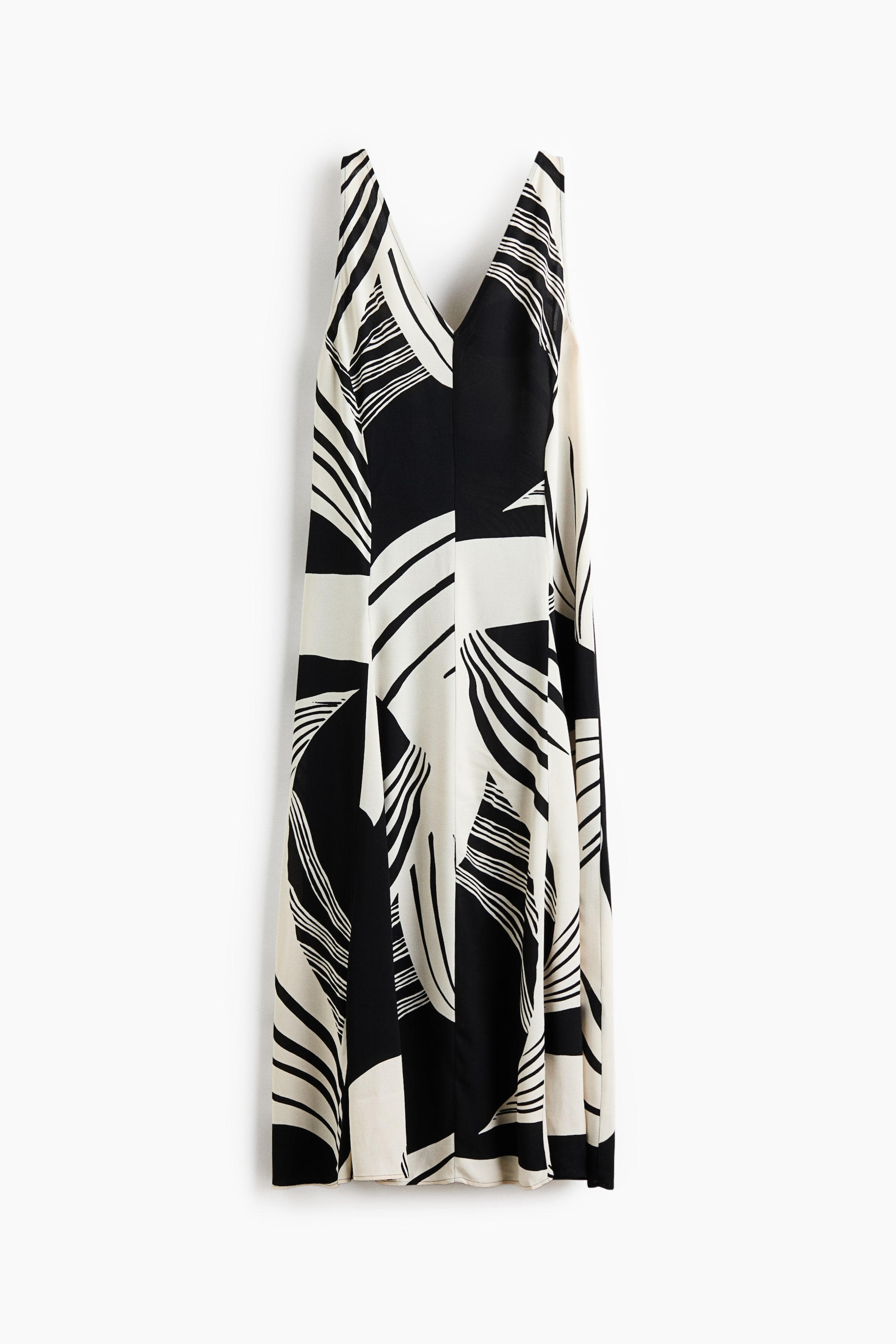 View larger image: The dress is displayed from the front, boasting a sleeveless design with a V-neckline. It features an abstract pattern of bold black and off-white curved and geometric shapes throughout its maxi length.