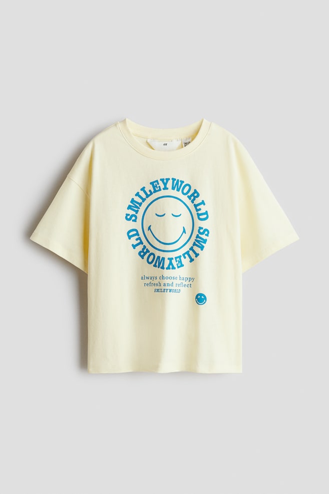 Printed Cotton T-Shirt - Light yellow/SmileyWorld®/Light blue/Snoopy/White/KPop Demon Hunters/Light pink/SmileyWorld®/Light gray melange/CapyFun/Light pink/KPop Demon Hunters/White/KPop Demon Hunters/Gray/KPop Demon Hunters - 1