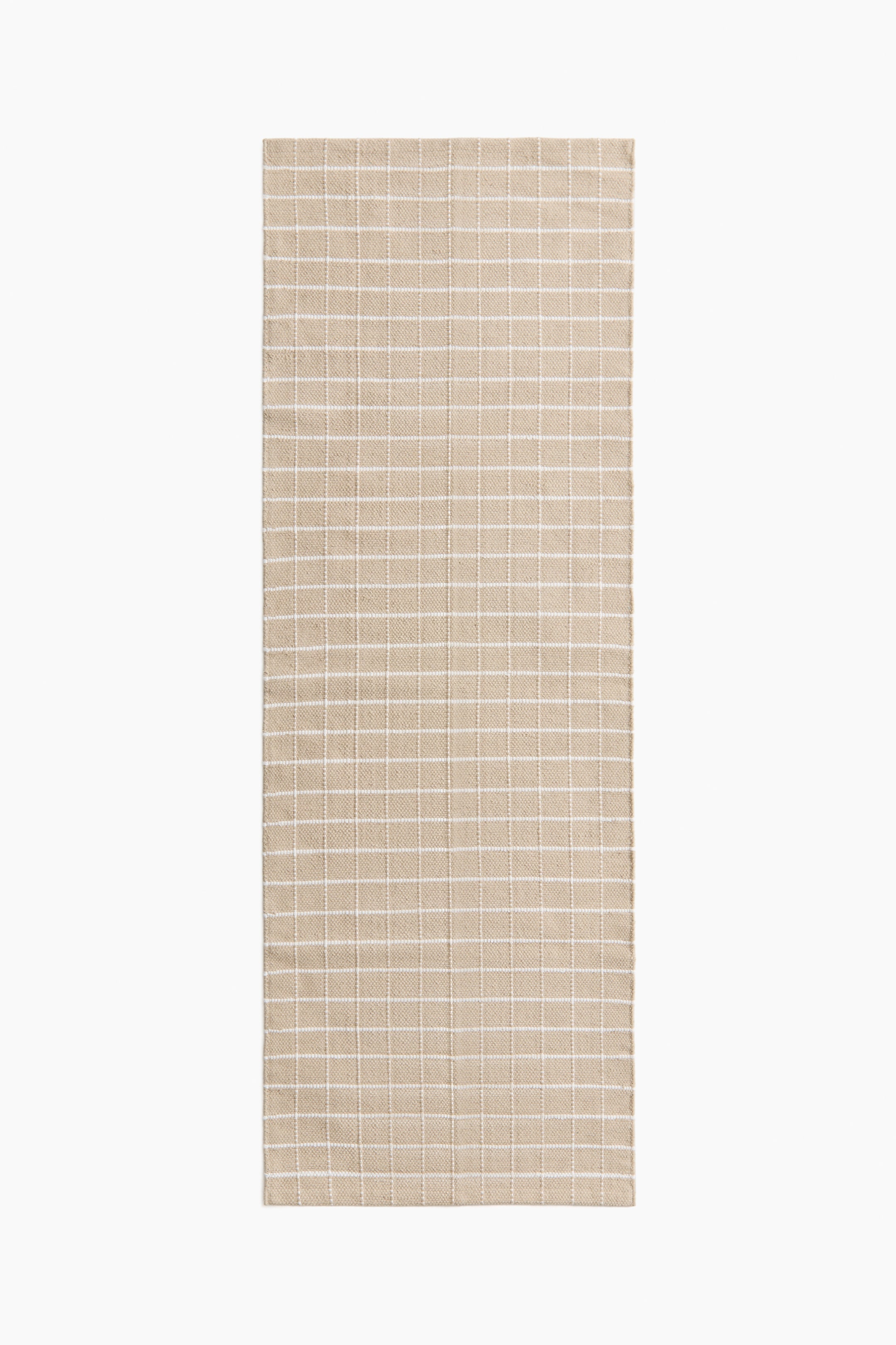 Visa större bild: En rektangulär beige vävd textil med ett konsekvent vitt rutmönster.