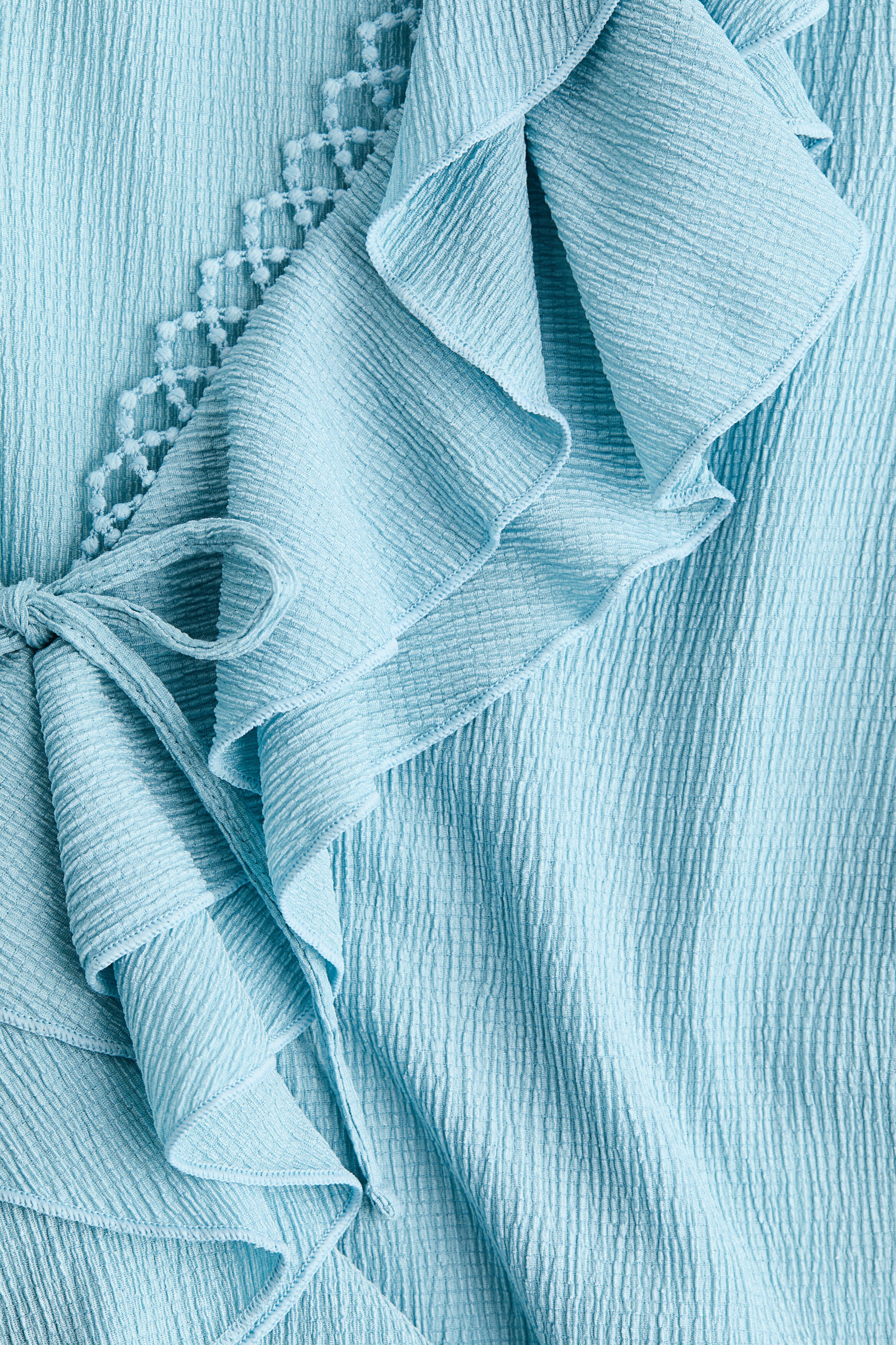 Flounce-trimmed blouse
