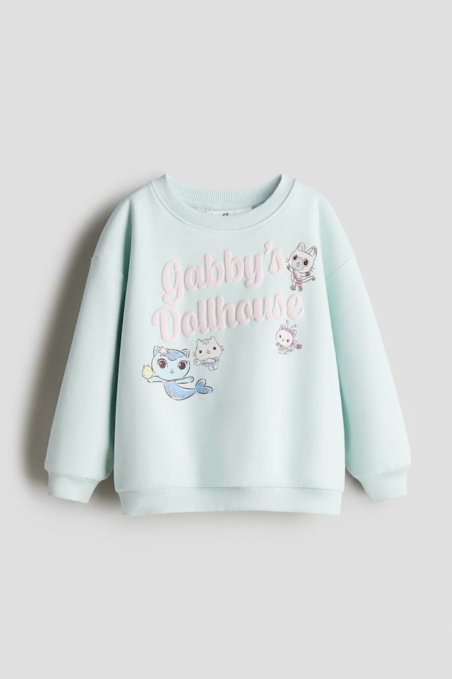 Printed Sweatshirt - Turquoise/Gabby's Dollhouse/White/Hello Kitty/Light blue/Hello Kitty/Gray melange/Lilo & Stitch/Pink/Hello Kitty/Cream/Hello Kitty/Purple/Lilo & Stitch/Pink/Lilo & Stitch/Light beige/Lilo & Stitch/Pink/Minnie Mouse/White/Peppa Pig/White/Minnie Mouse/Light blue/Cinnamoroll/Pink/Peppa Pig/Light purple/pink/Light blue/Frozen/Light pink/Squishmallows/Cream/Bluey/Light purple/Hello Kitty/White/Kuromi - 1