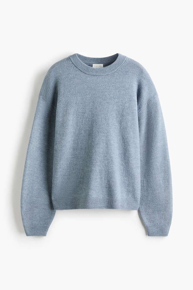 A light blue, brushed knit jumper is lying flat and facing forward. It features a round ribbed neckline, long sleeves with dropped shoulders, ribbed cuffs, and a ribbed hem. - 1