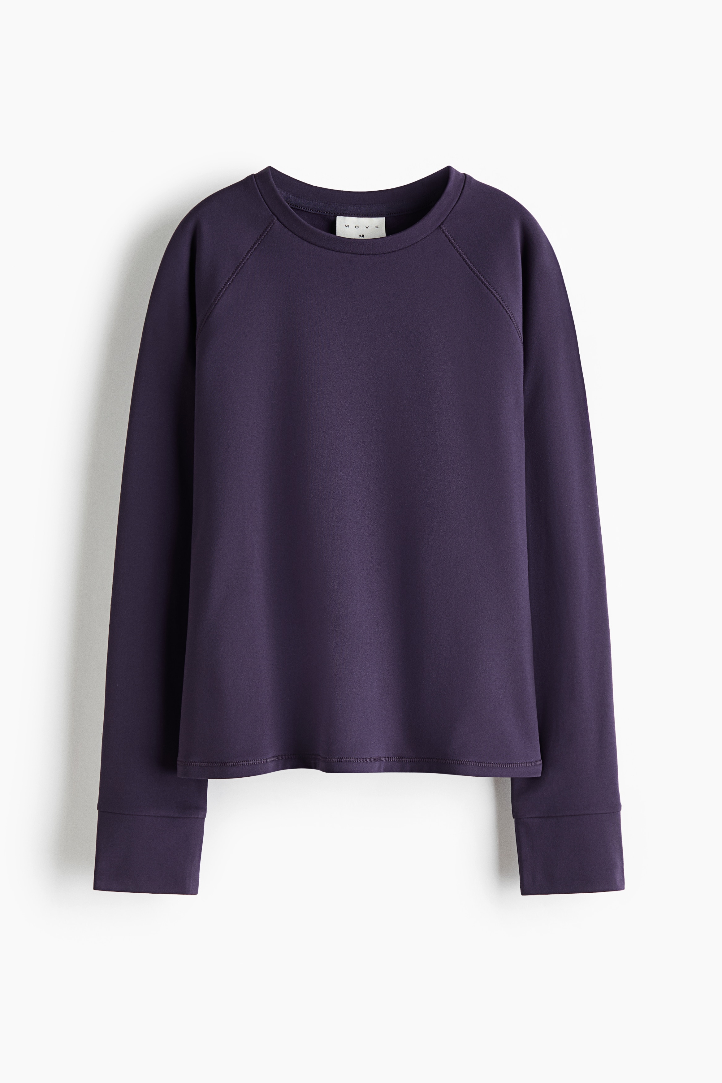 A dark purple long-sleeved top and matching leggings set is shown from the front. The top features a crew neck, raglan sleeves and wide cuffs, while the matching leggings sit close at the waist.