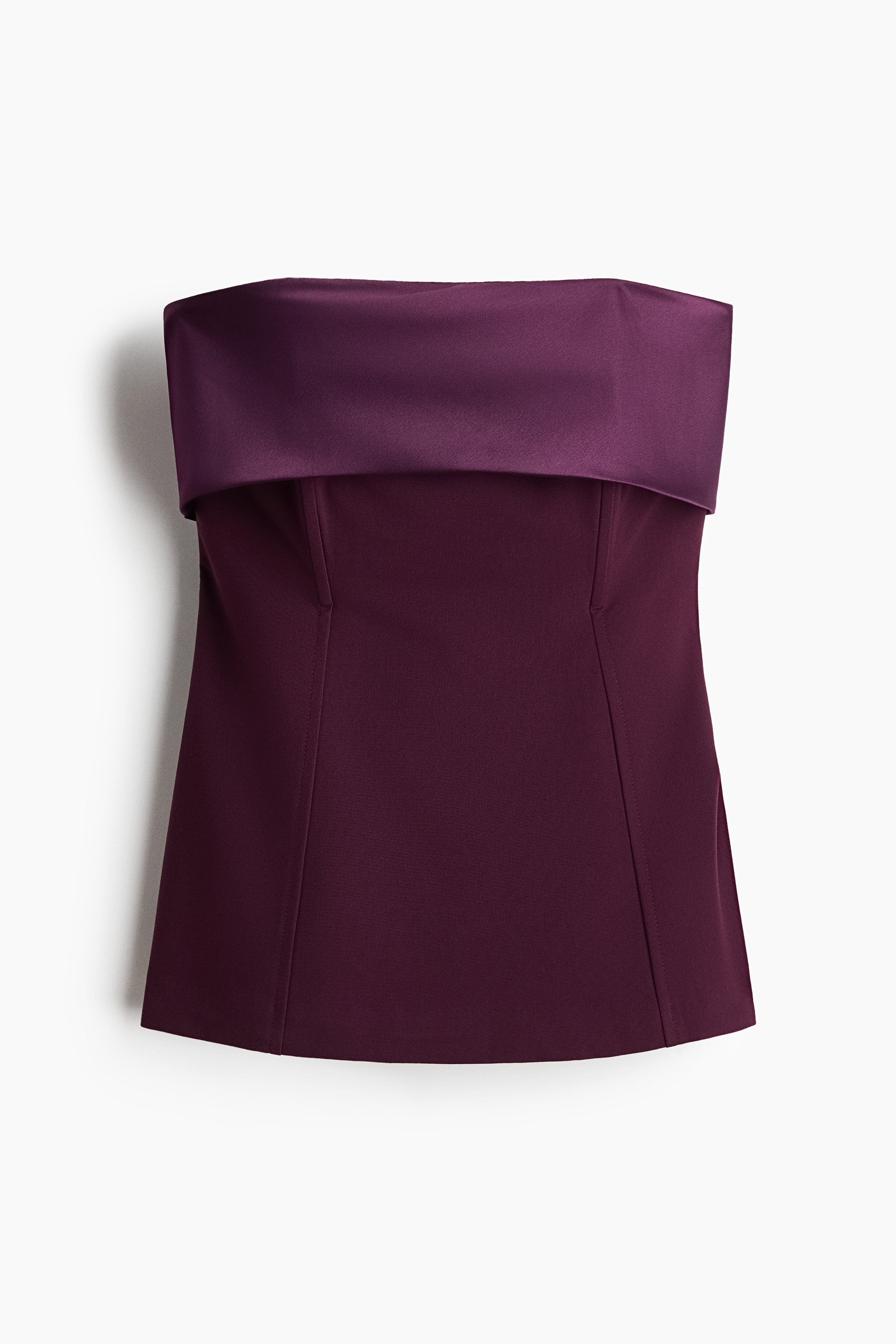This strapless, deep purple top is facing front, showcasing a wide, lustrous satin fold-over band along the neckline. The structured matte bodice features vertical princess seams extending down to the straight hem.