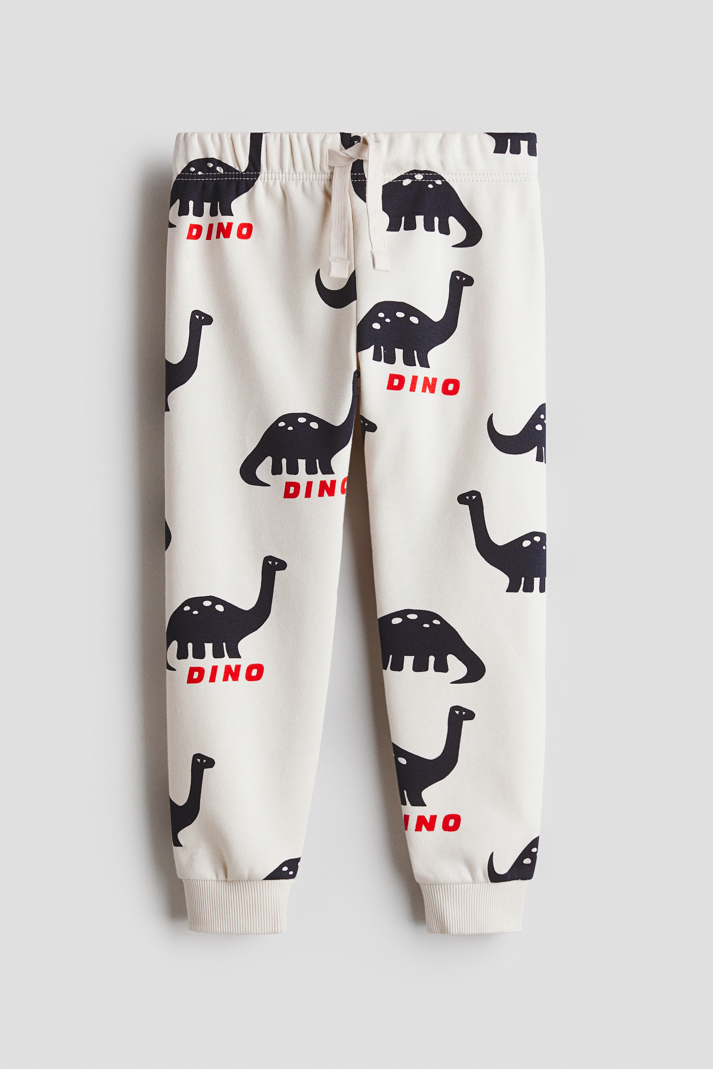 Light beige/dinosaurs Printed Joggers for kids | H&M CA