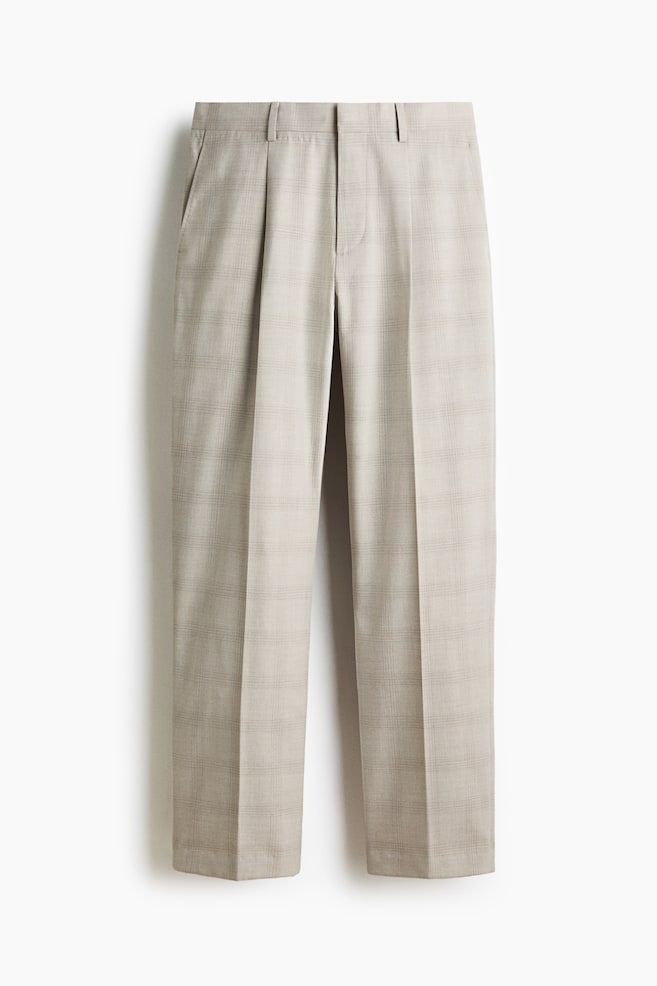 Light beige trousers with a subtle check pattern are facing forward. They feature belt loops, a zip fly, side pockets, single pleats and straight legs with a pressed crease. - 1
