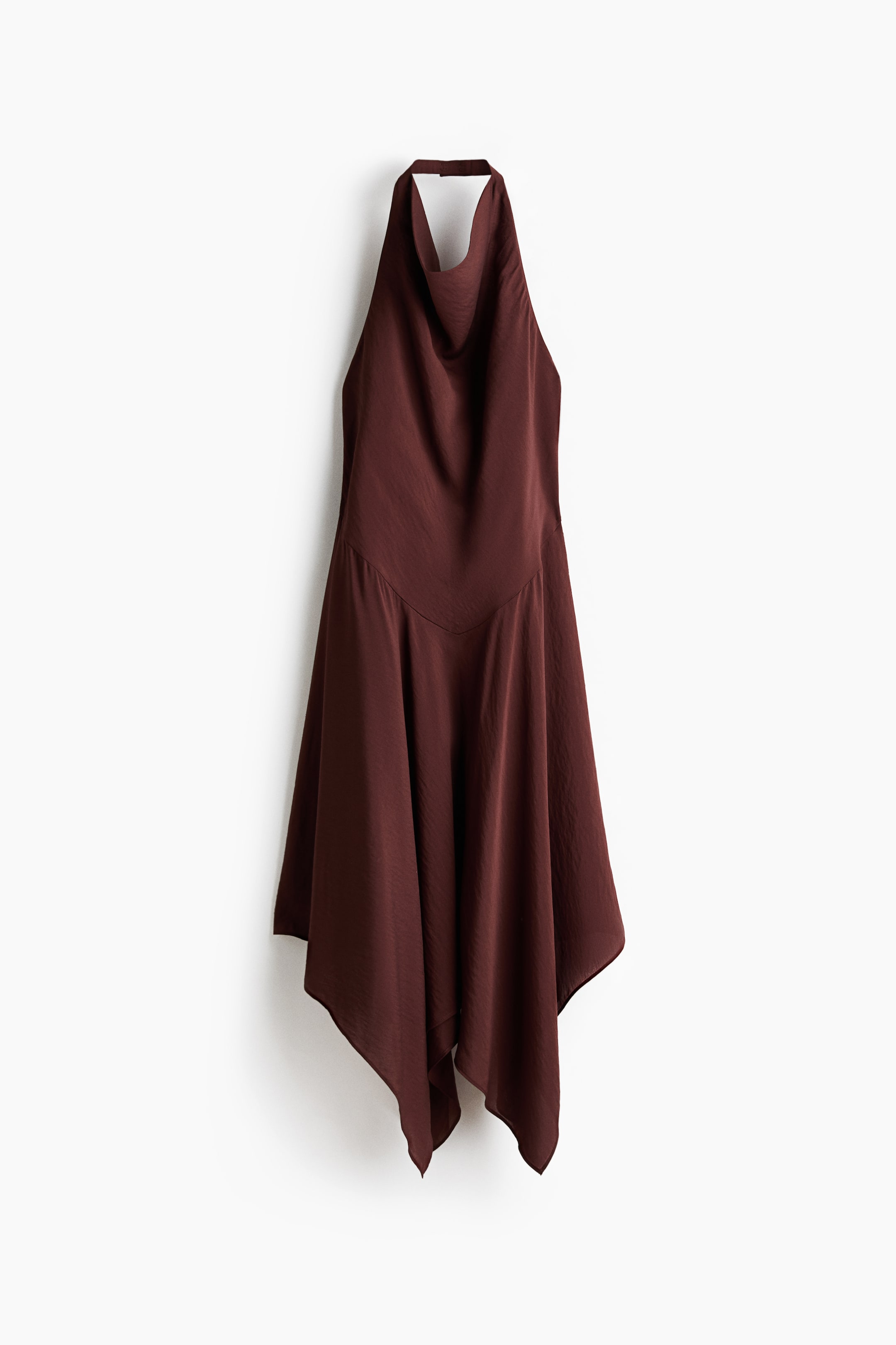 View larger image: A brown halter neck dress, front view, showcases a draped cowl neckline and a V-shaped seam at the upper hip. The fabric, with a silky appearance, flows into an asymmetric handkerchief hem.