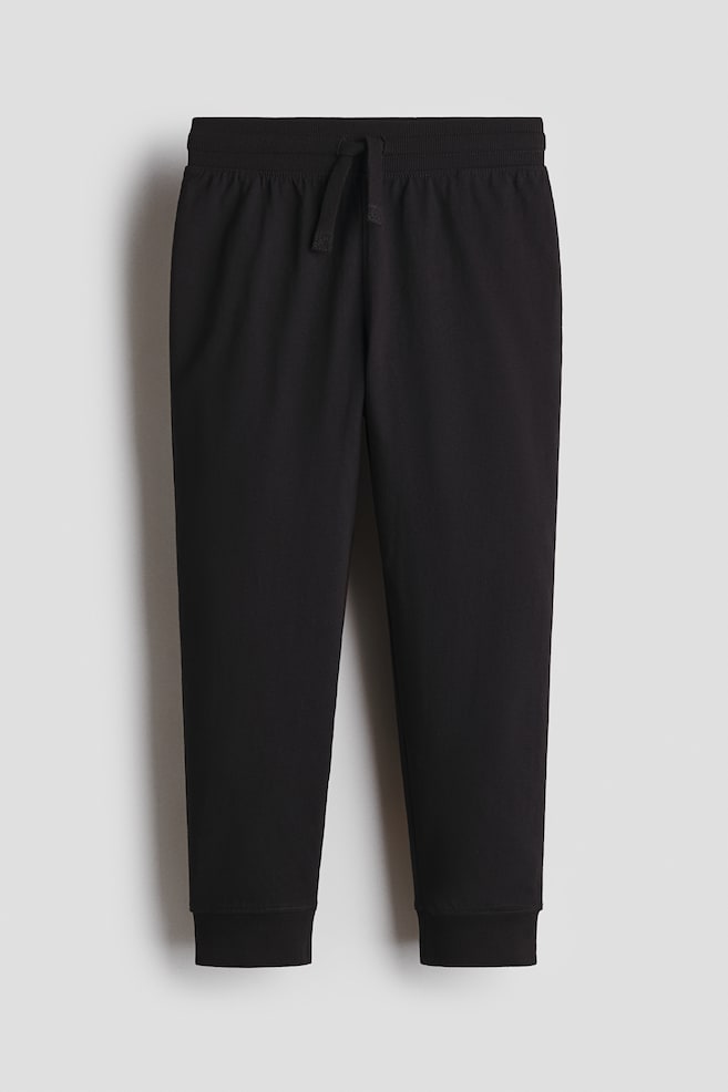 Joggpants aus Baumwolle - Schwarz/Hellgraumeliert - 1