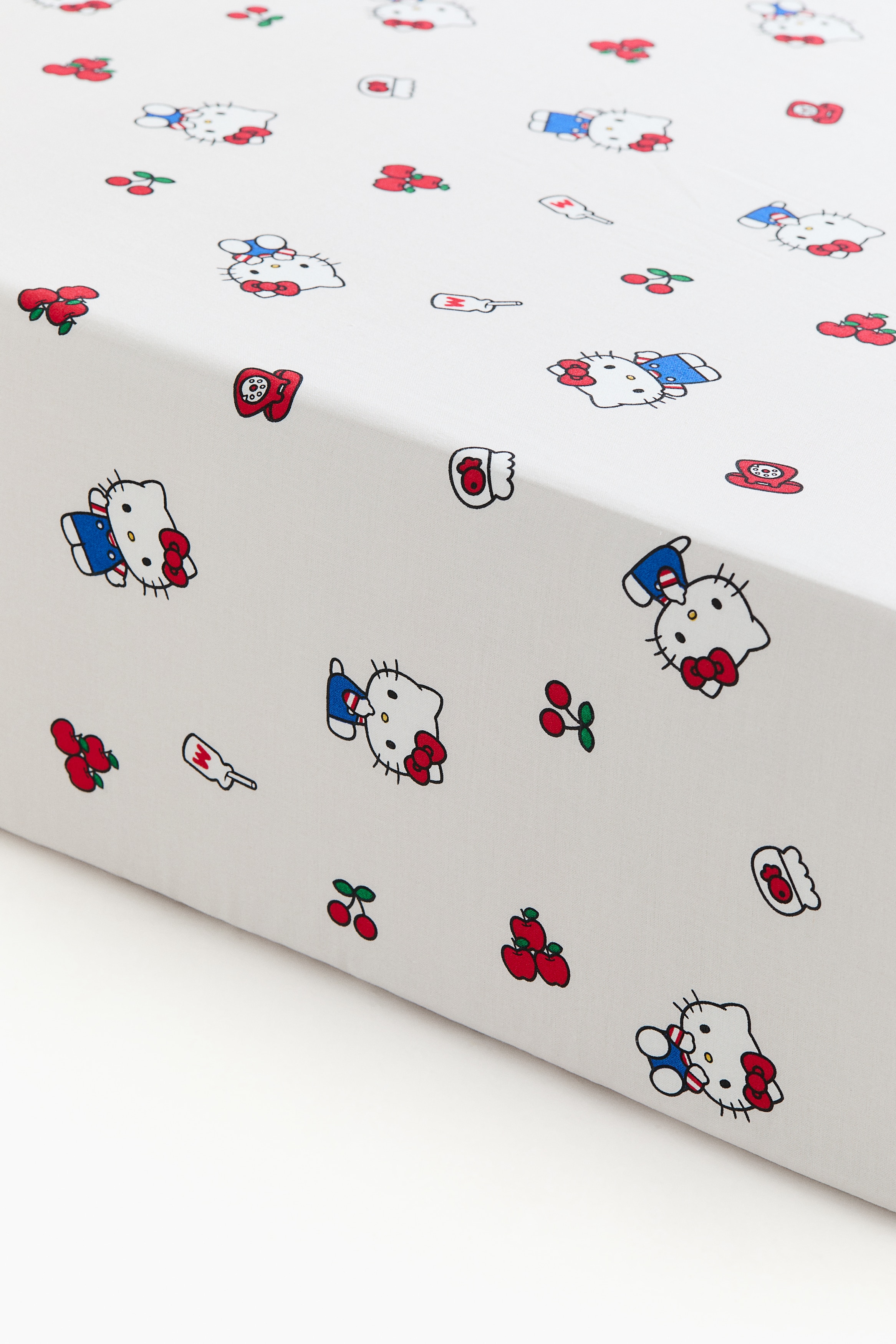 H&M Home  - Bawełniane wzorzyste prześcieradło z gumką - Kremowy/Hello Kitty - size: 90x200