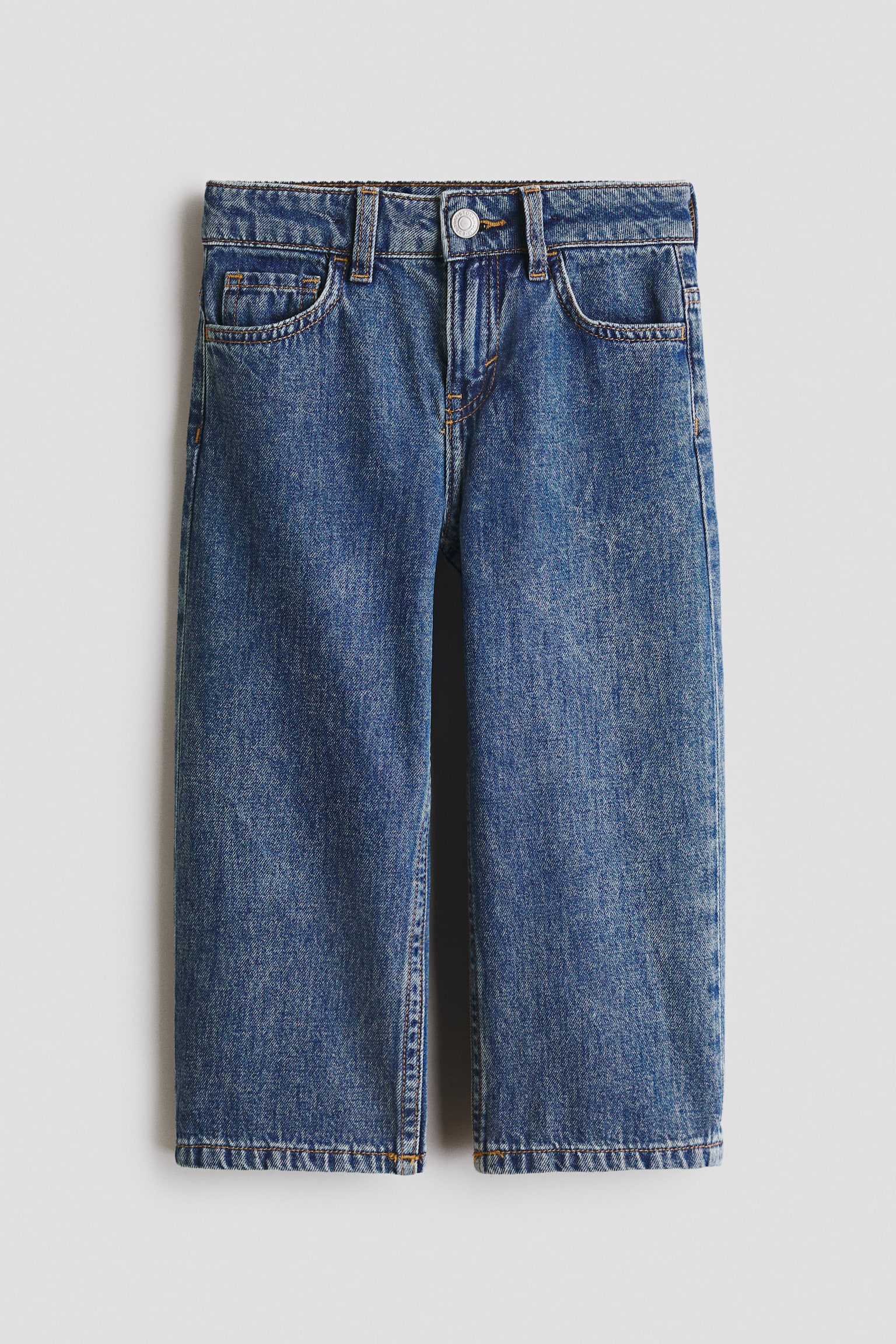 Five-pocket denim jeans showcasing a relaxed fit, viewed from a flat-lay front angle. They feature a silver-toned press-stud fastening at the waist, two front pockets, a coin pocket, and contrasting light brown stitching throughout. - 1
