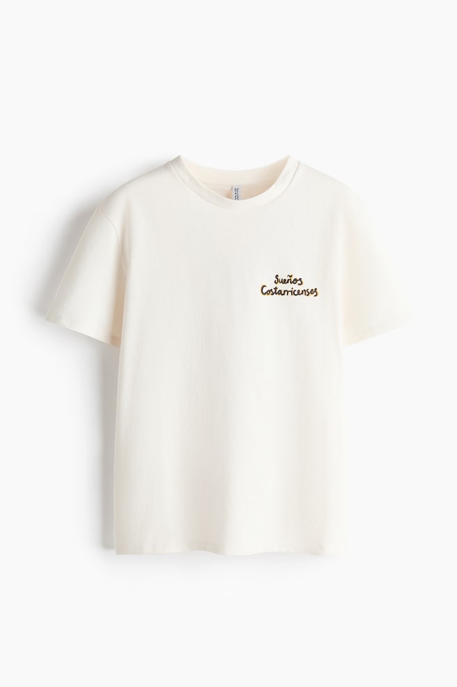 Appliquéd T-shirt - Cream/Sueños Costarricenses/Black/Flowers/Cream/Olives/Black/Toucan/Cream/Seashells - 1