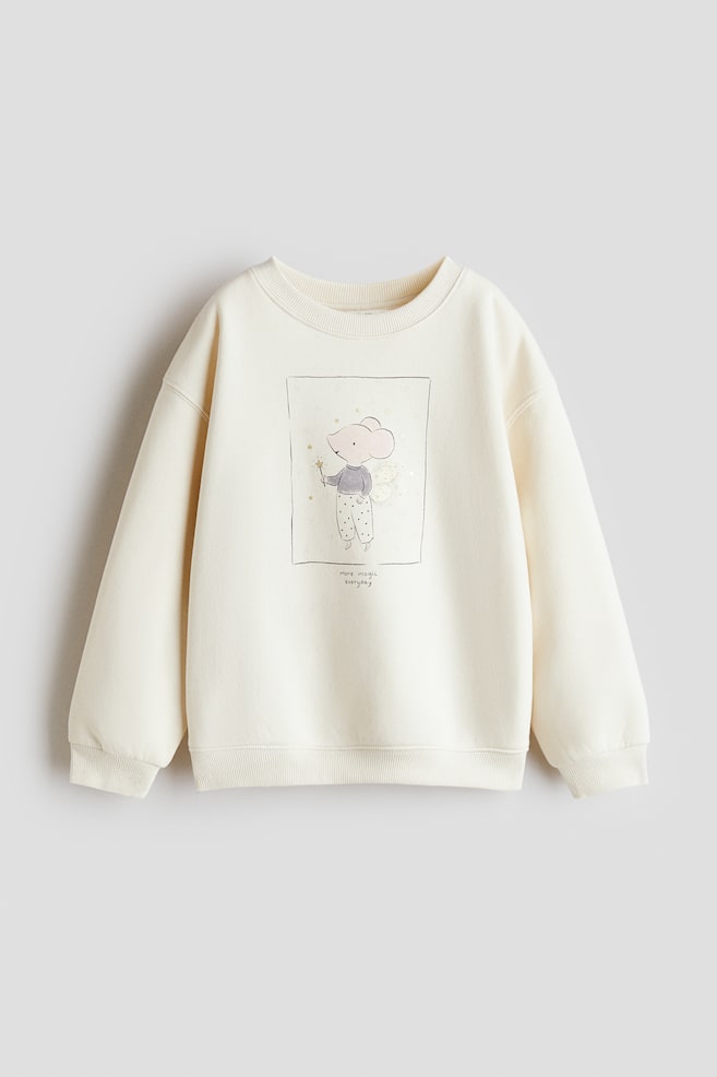 Felpa con motivo e interno spazzolato - Crema/topo/Avorio/Milan/Rosa polvere chiaro/unicorno/Grigio chiaro mélange/Mon Amie/Giallo/cuore/Turchese chiaro/Paris/Rosa cipria/unicorno/Talpa mélange/Pegaso/Avorio/stelle/Bianco/ciliegie/Rosa cipria/orsetto/Crema/cani - 1