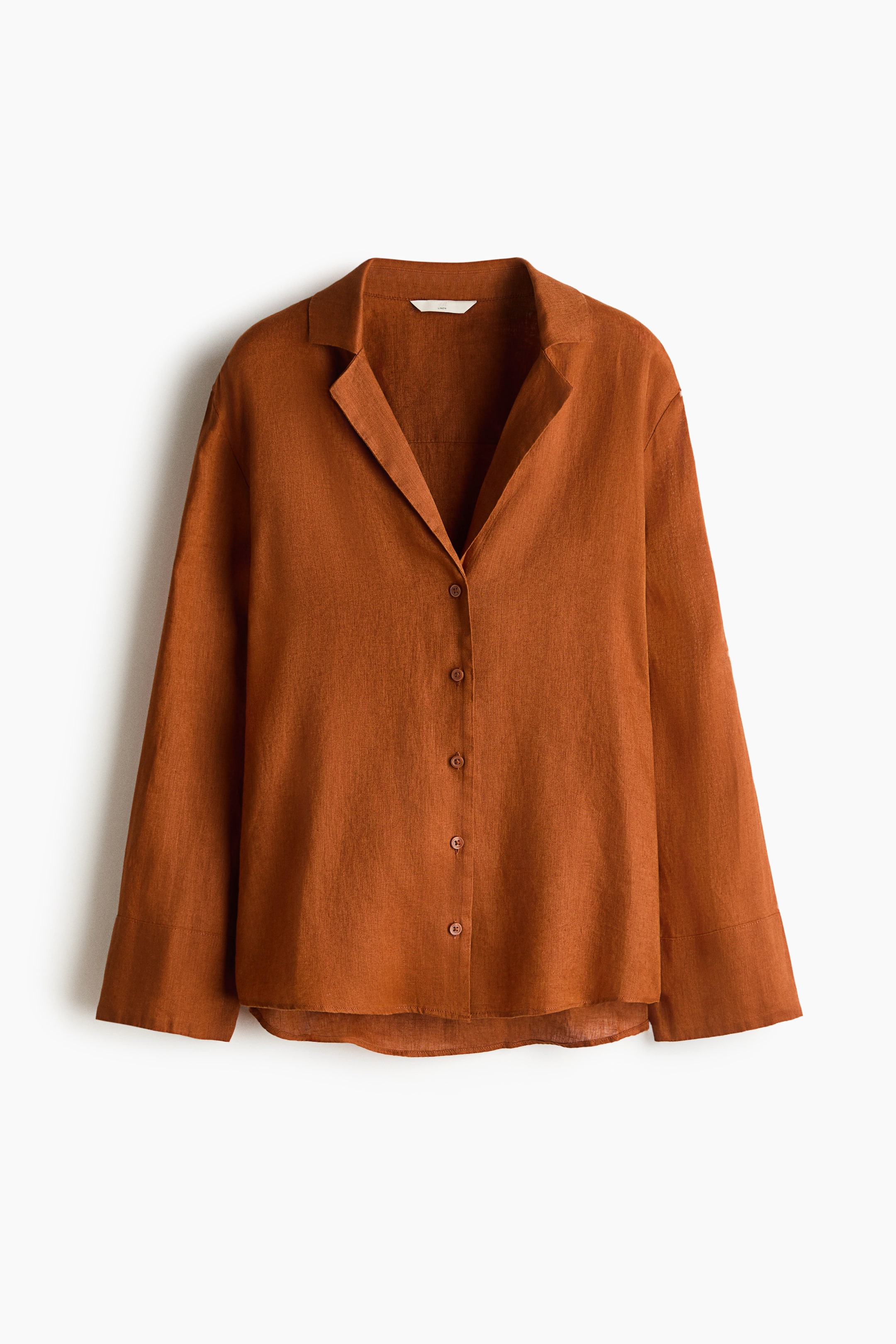View larger image: An oversized shirt in a linen weave features a resort collar, button-down front, slightly dropped shoulders, and long cuffed sleeves.
