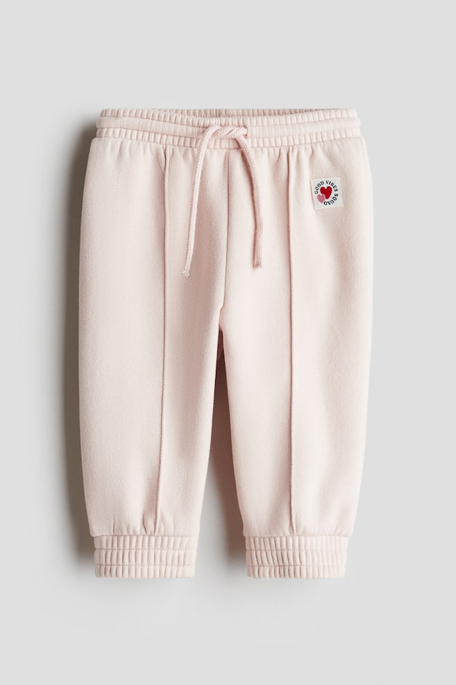 Pantalon jogger à l'intérieur brossé - Rose clair/Good Vibes Squad - 1