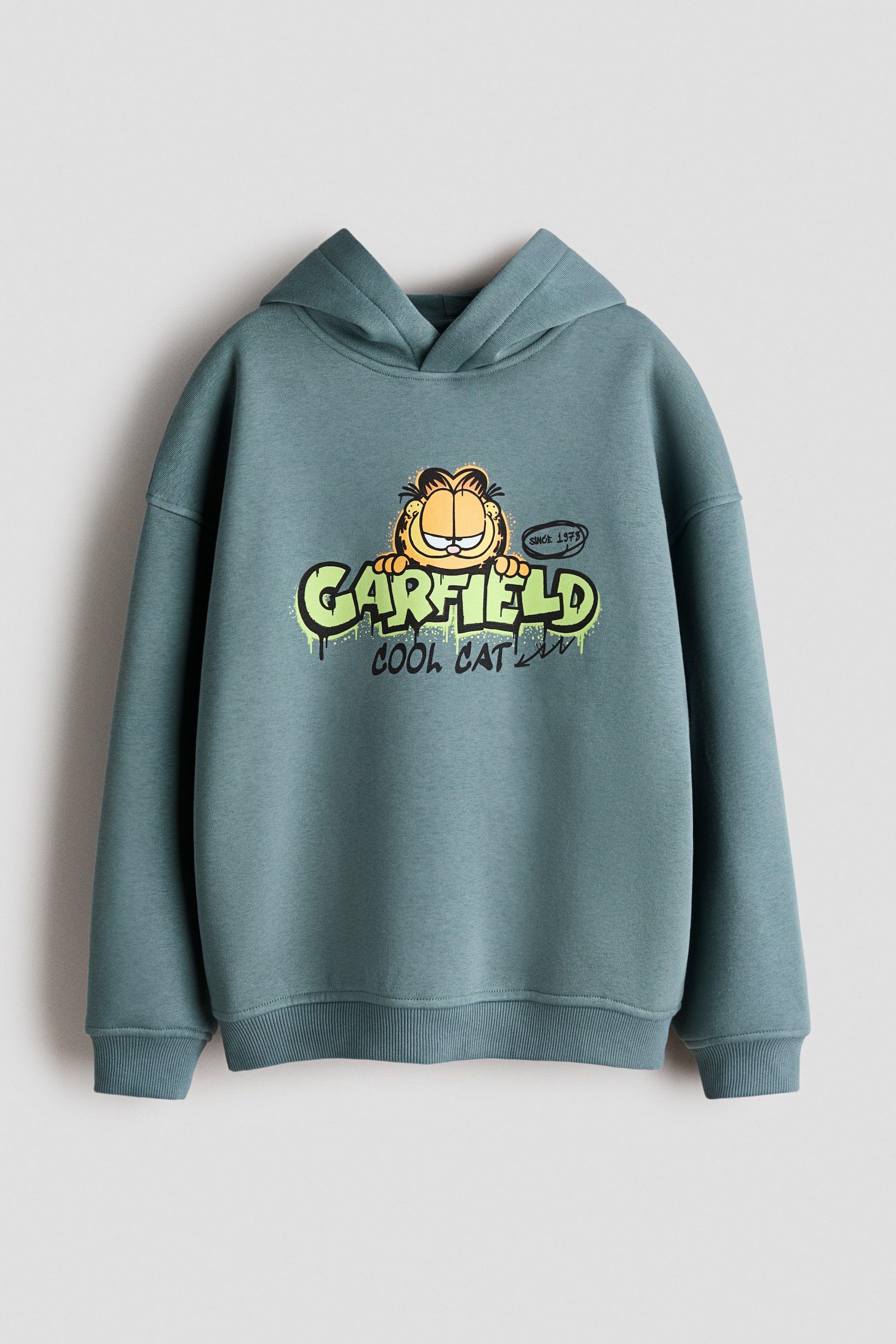 Visa större bild: Huvtröja med tryckta motiv - Turkos/Katten Gustaf - BARN | H&M SE 1