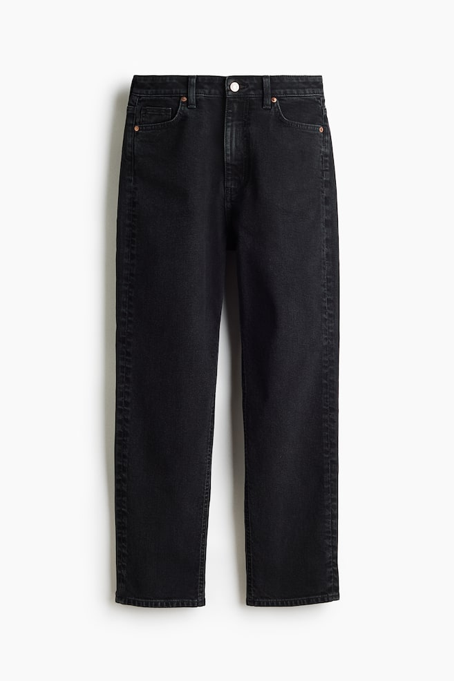 Black 5-pocket denim jeans feature a high waist with a button and zip fly closure at the front. The straight leg tapers to an ankle-length hem, with copper-toned rivets accentuating the pockets. - 1