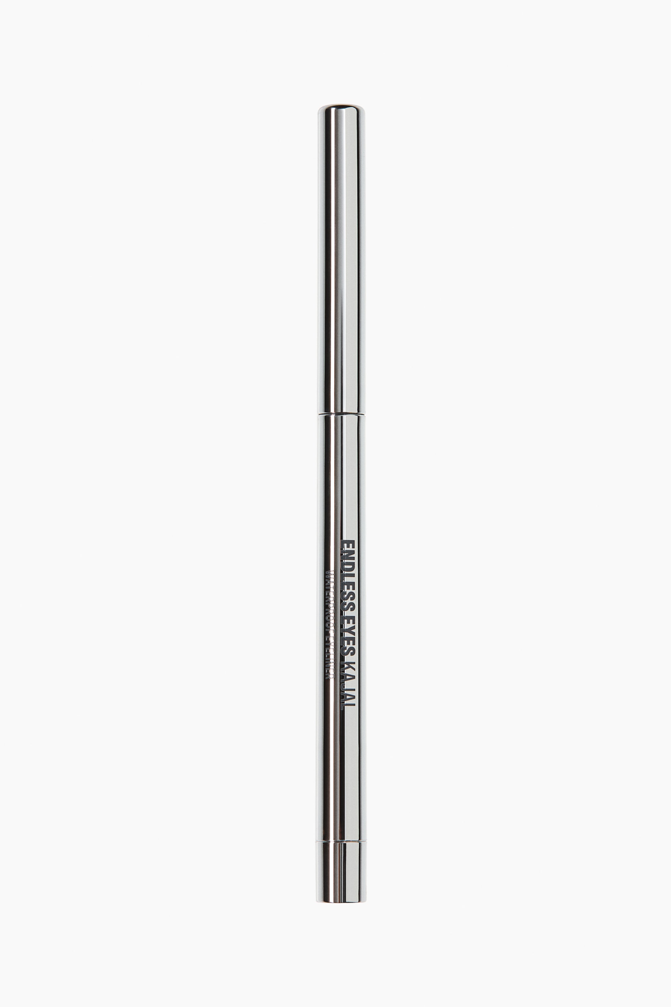 View larger image: A sleek, metallic silver kajal eyeliner pencil stands vertically, showcasing its front-facing design. The reflective, chrome-finished cylindrical body features black vertical text that reads "ENDLESS EYES KAJAL" and "WATERPROOF EYELINER."