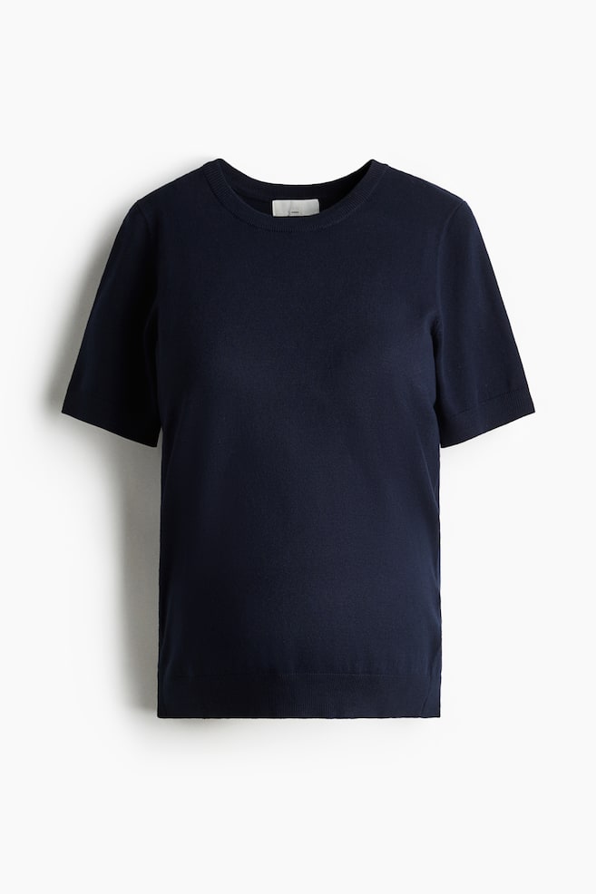 A navy short-sleeved knit top is presented from the front, featuring a crew neck. It is designed with ribbed sleeve cuffs and a ribbed hem, showcasing a fine knit texture. - 1