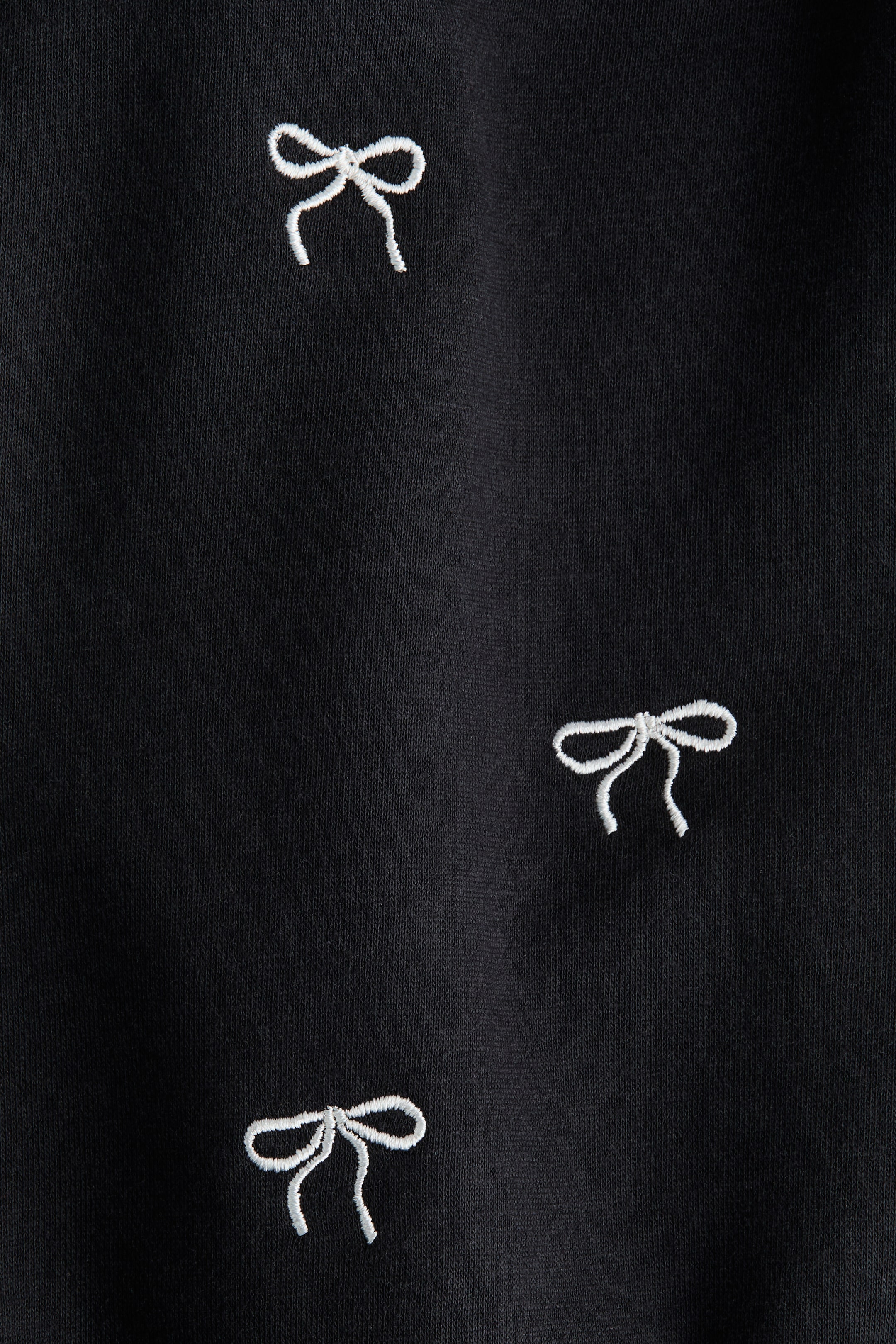 Größeres Bild anzeigen: Sweatshirt mit Zierschleife - Schwarz/Schleifen - Kids | H&M AT 2