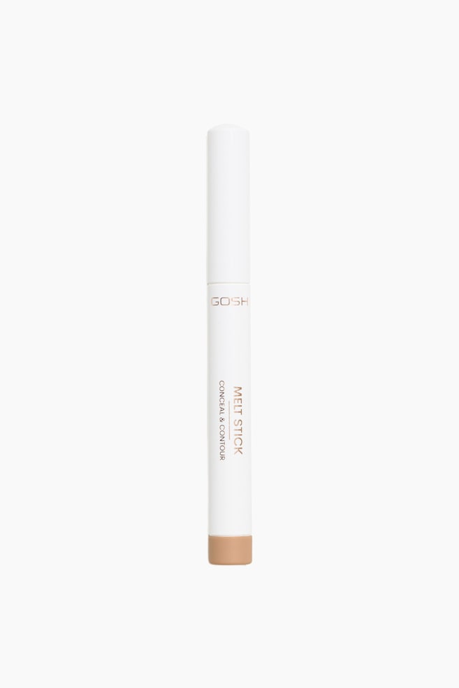 Melt Stick Conceal & Contour stÃ¥r lodret og prÃ¦senterer et slankt, hvidt cylindrisk design med en matchende hÃ¦tte. Forsiden af pennen viser branding og produkttekst i metallisk rosaguld, mens et tan-farvet segment ved basen angiver farven. - 1