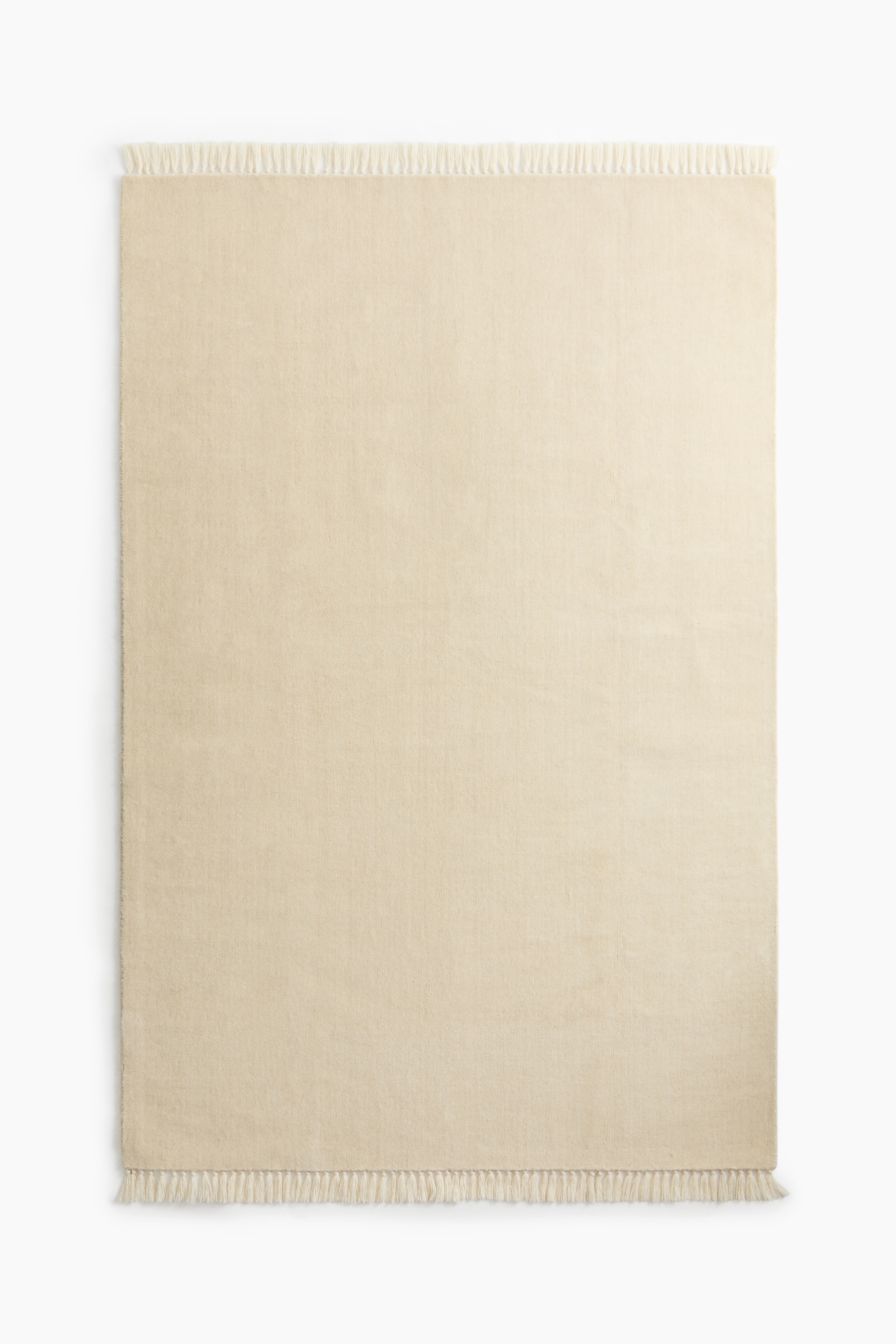 Grand tapis à franges en laine mélangéeModèle