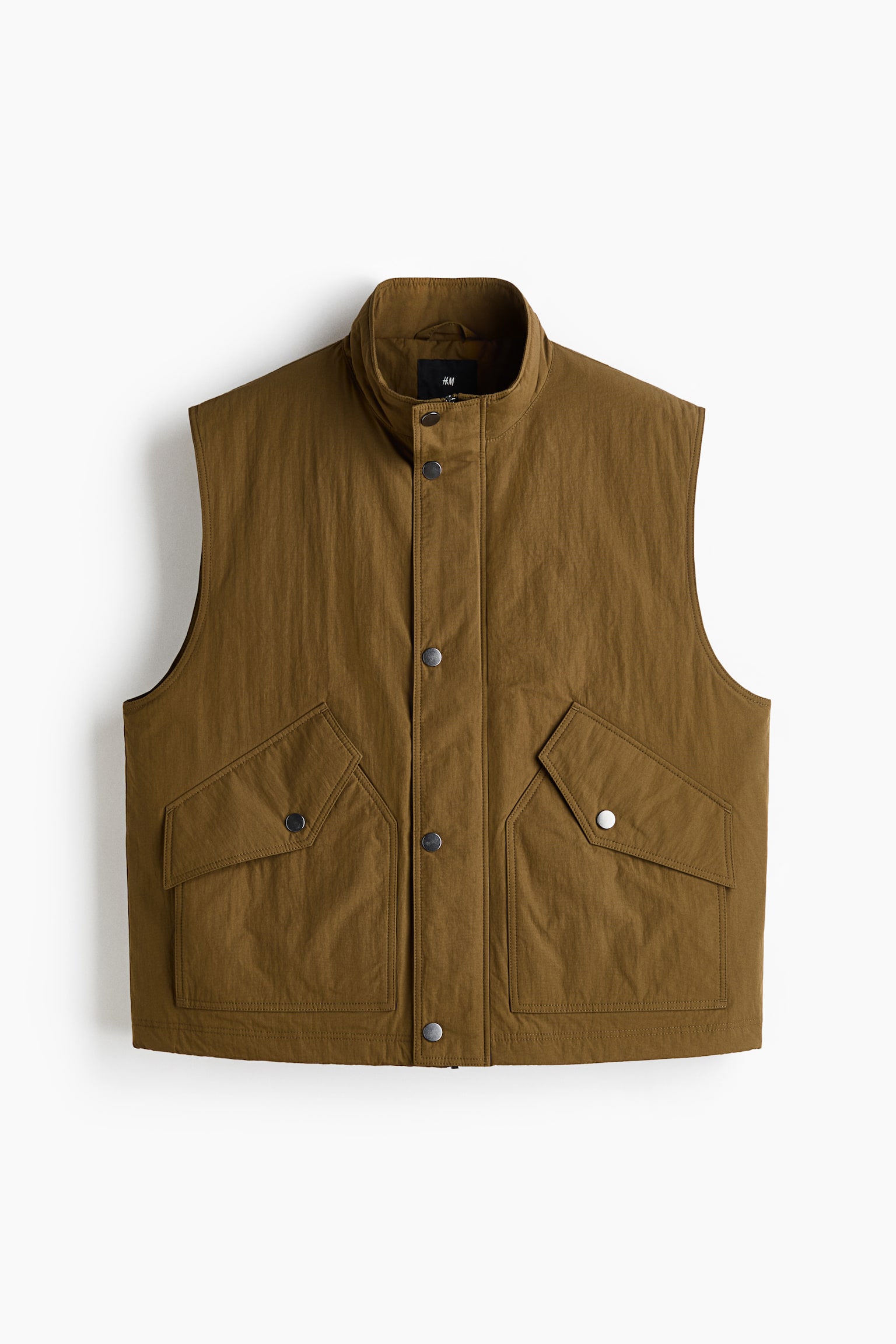 A muted olive green vest showcases its front, featuring a stand-up collar and a full snap-button placket. Two large flap pockets with snap closures are visible on the lower front.