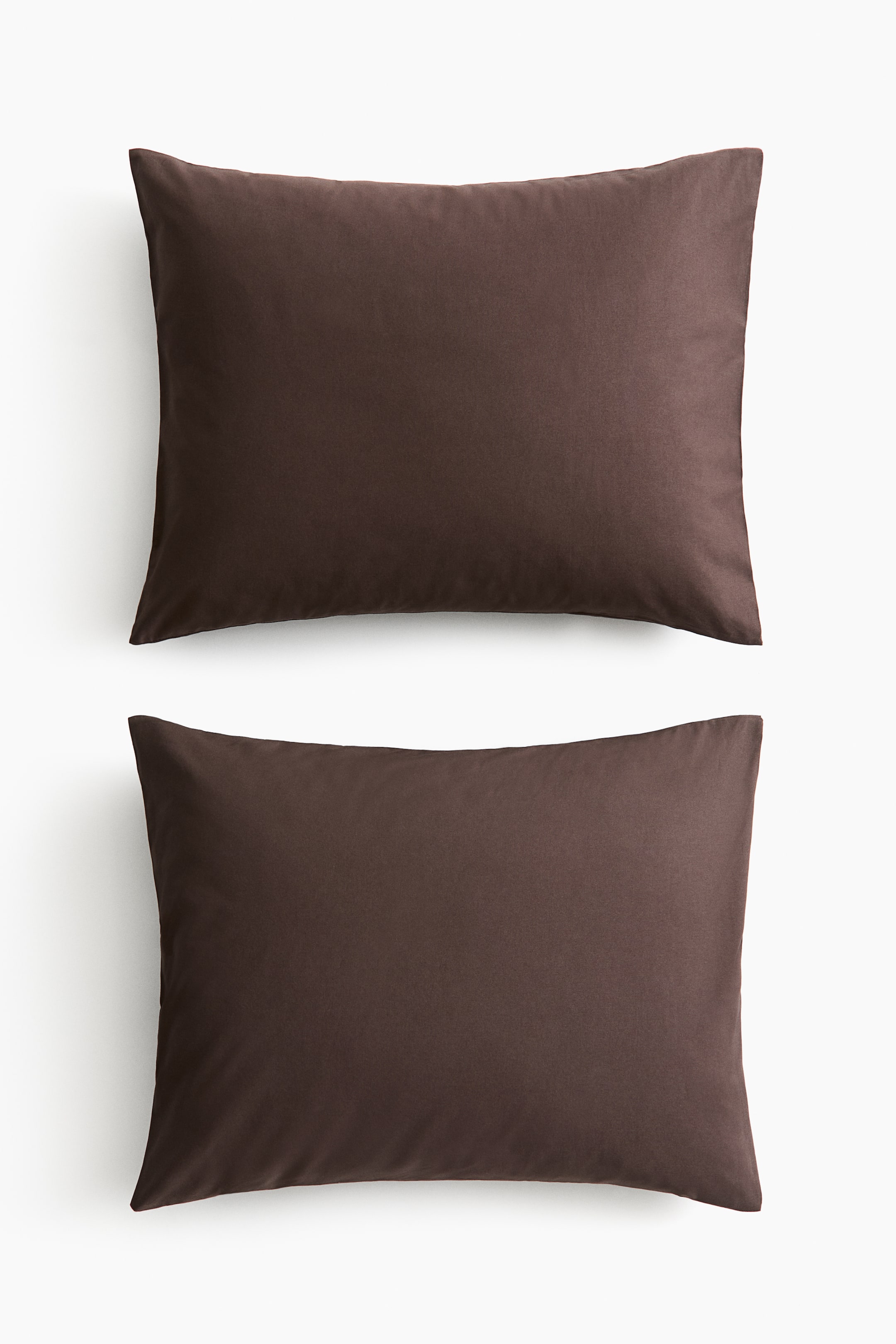 View larger image: A pair of dark brown pillowcases is presenting a smooth, soft cotton weave, lying flat and facing front.