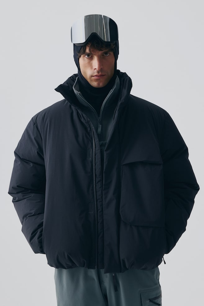 Sport-Pufferjacke mit ThermoMove™ - Schwarz - 1
