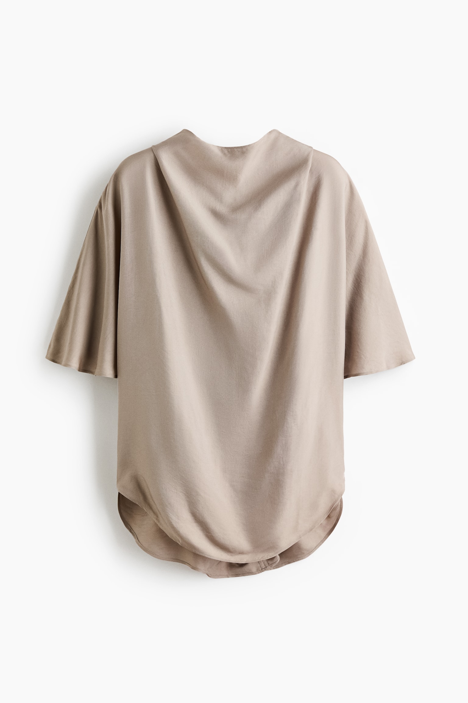 A taupe loose-fitting top is showcasing its back, featuring a draped neckline, wide short sleeves, and a rounded hem. - 1