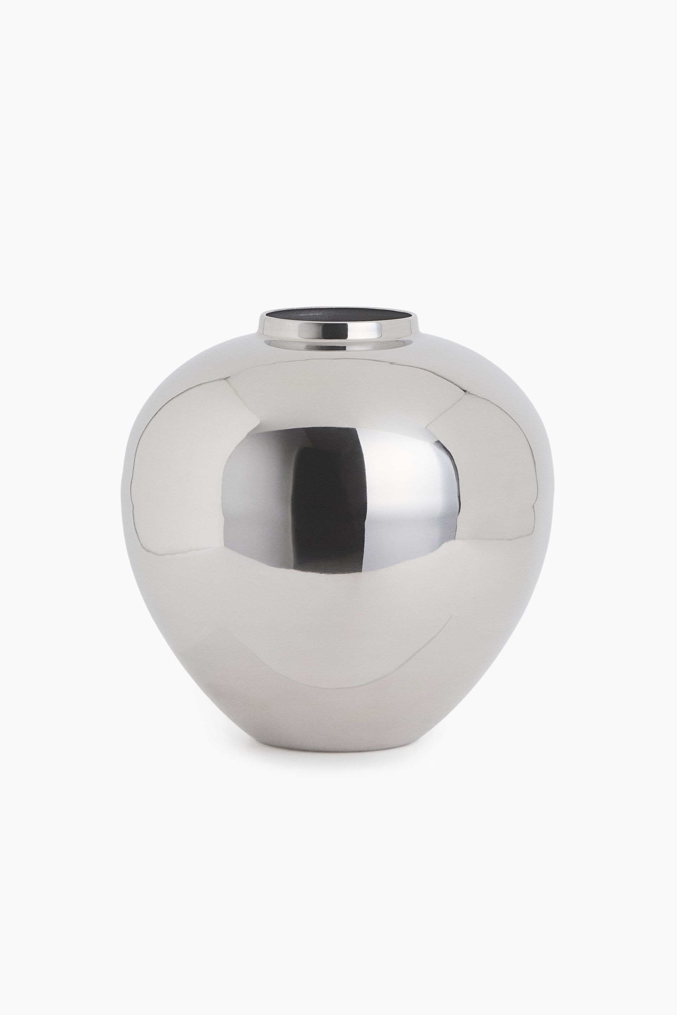 View larger image: A silver-toned metallic vase is standing upright in a front view, showcasing a bulbous, rounded body with a highly reflective, polished surface. It narrows at the top into a short, cylindrical neck with a circular opening.