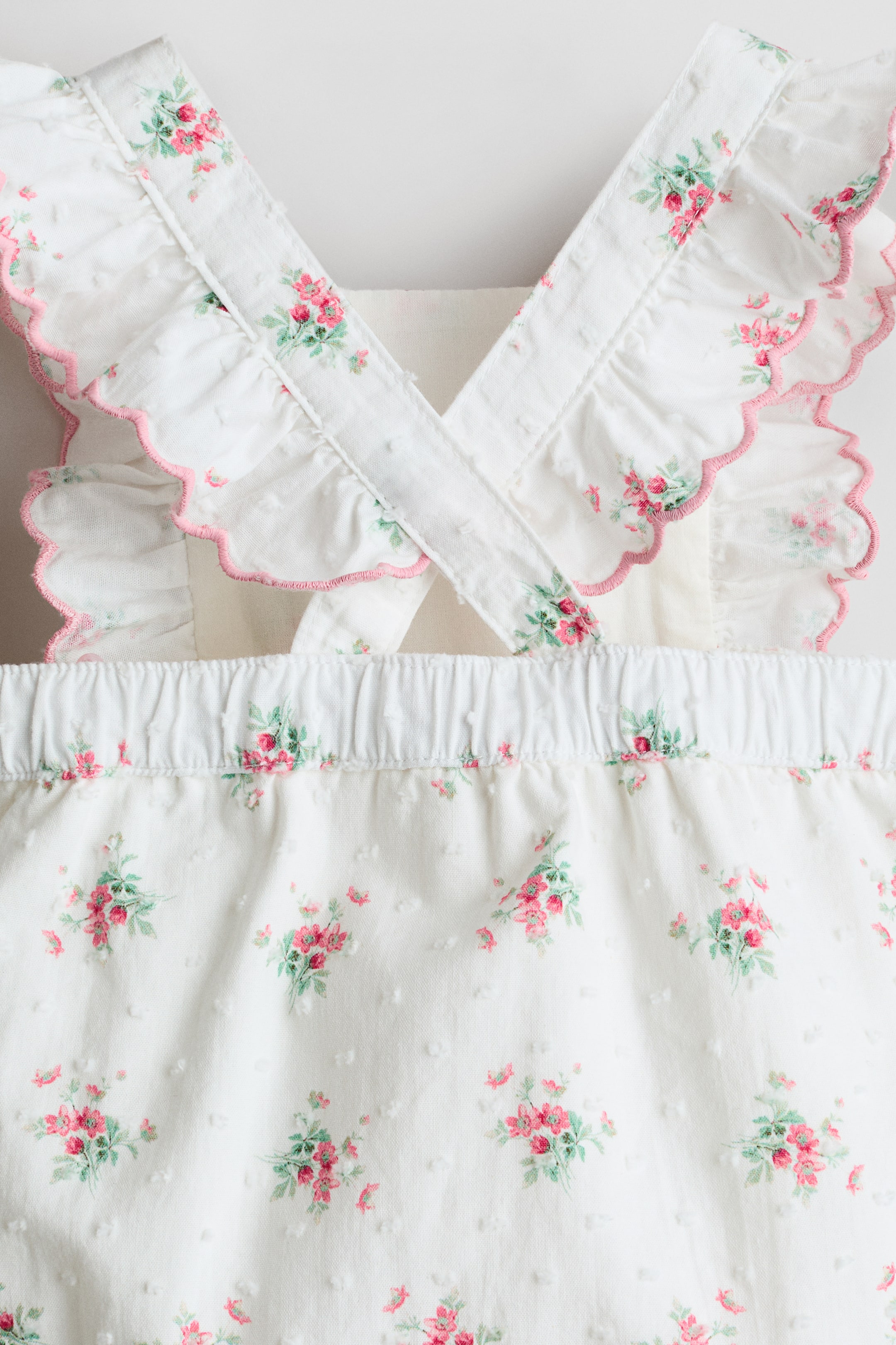 Ruffle-Trimmed Cotton Romper Suit