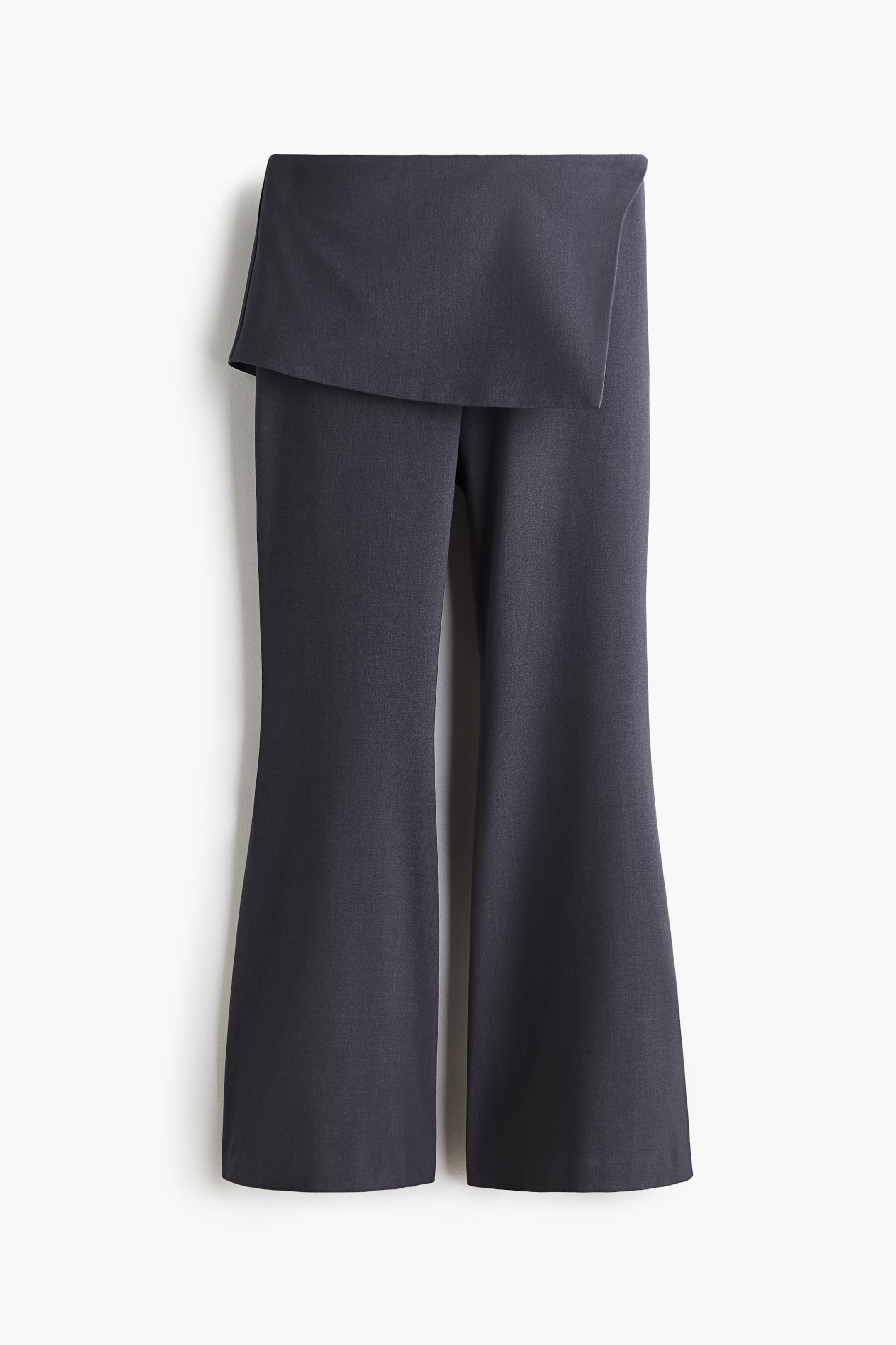 View larger image: FRONT view of dark gray pants featuring a wide, asymmetric draped panel at the waist. The legs are straight, subtly flaring towards the hem.