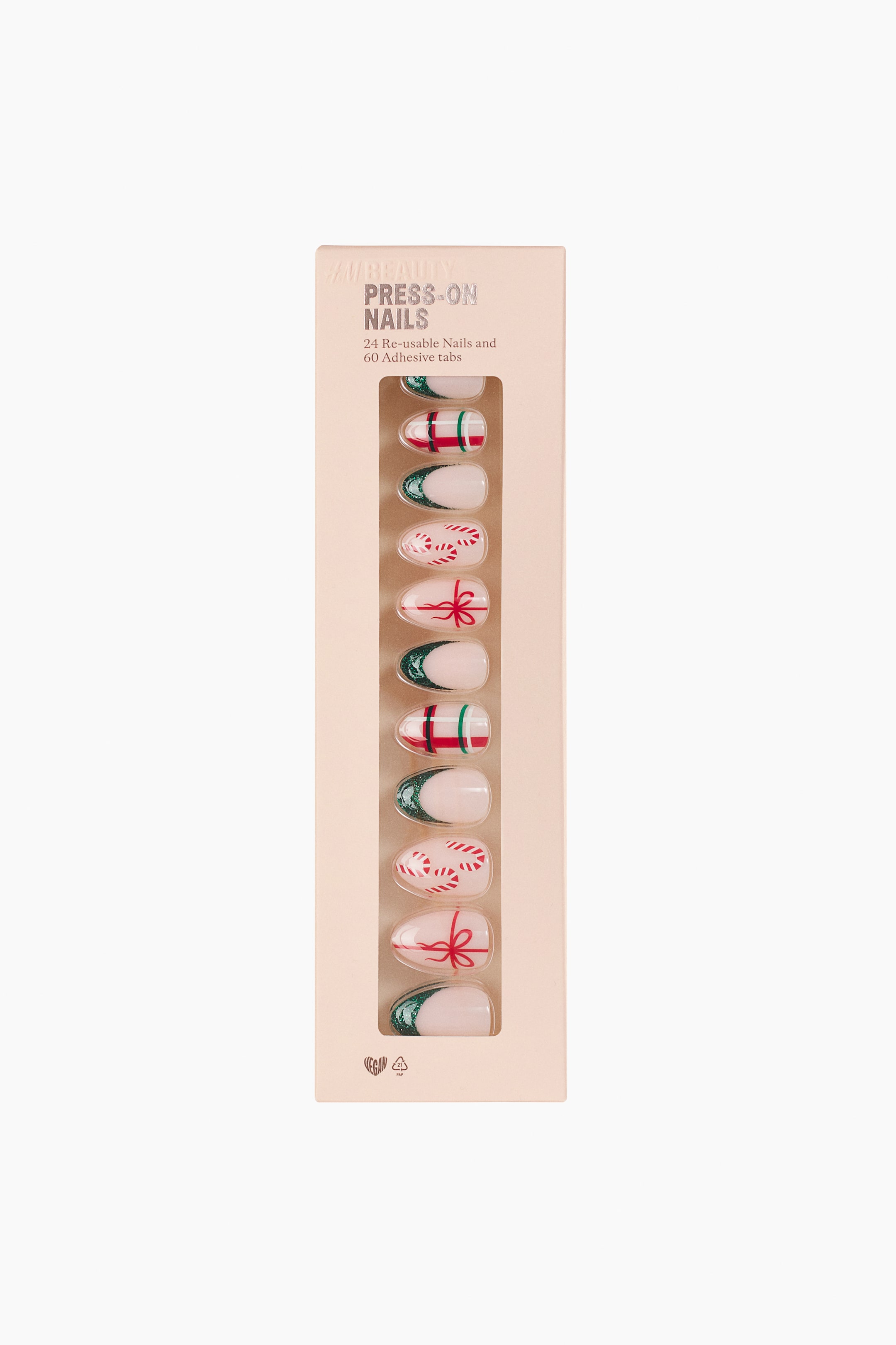 Größeres Bild anzeigen: Ein Set Press-on-Nägel wird von vorne in einer hellrosa rechteckigen Box mit transparenter Sichtfenster präsentiert. Die mandelförmigen Nägel zeigen verschiedene Designs, darunter grüne French Tips mit Glitzer, rot-grüne Karomuster, rote Schleifen und Zuckerstangen.
