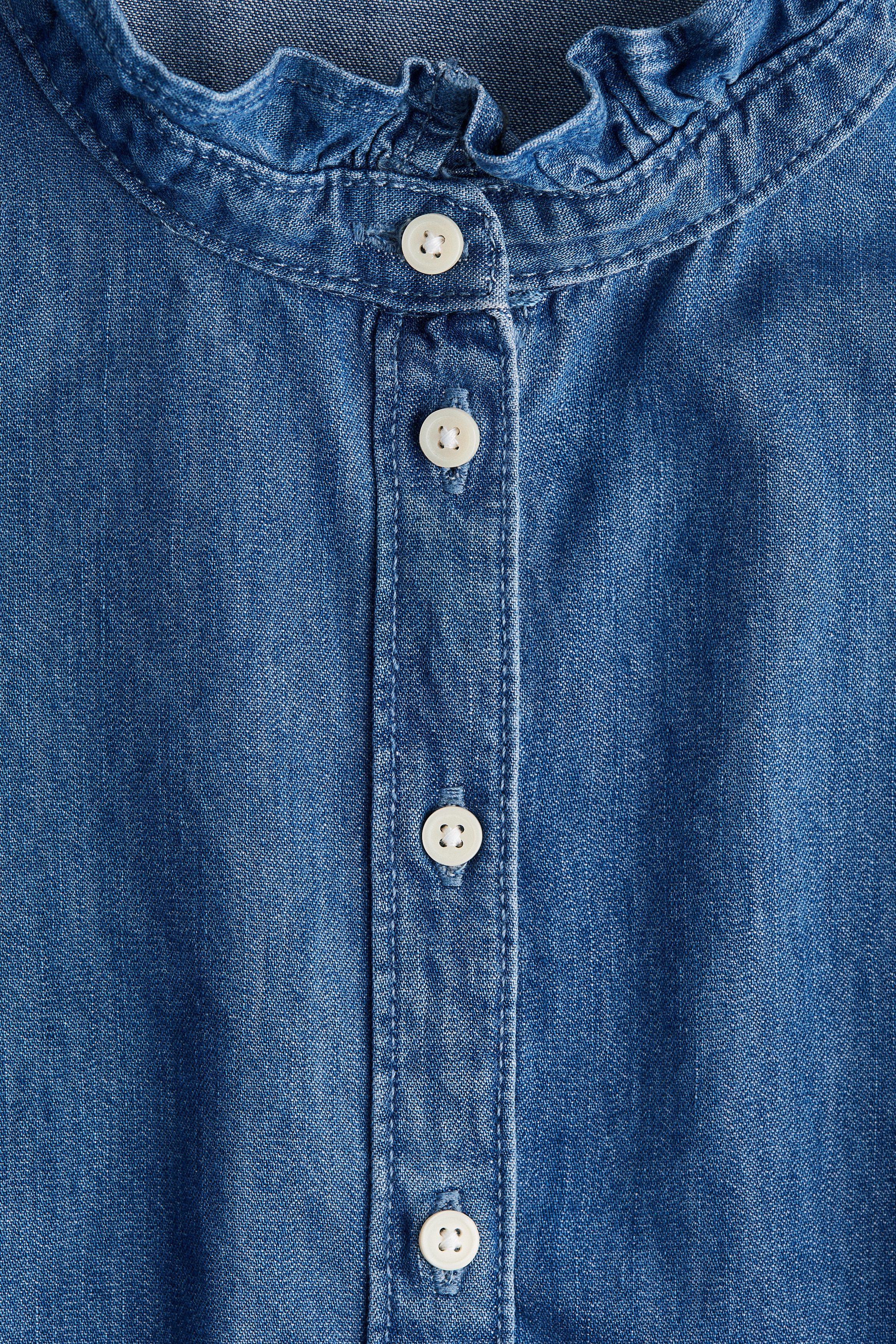 Frill-trimmed denim blouse