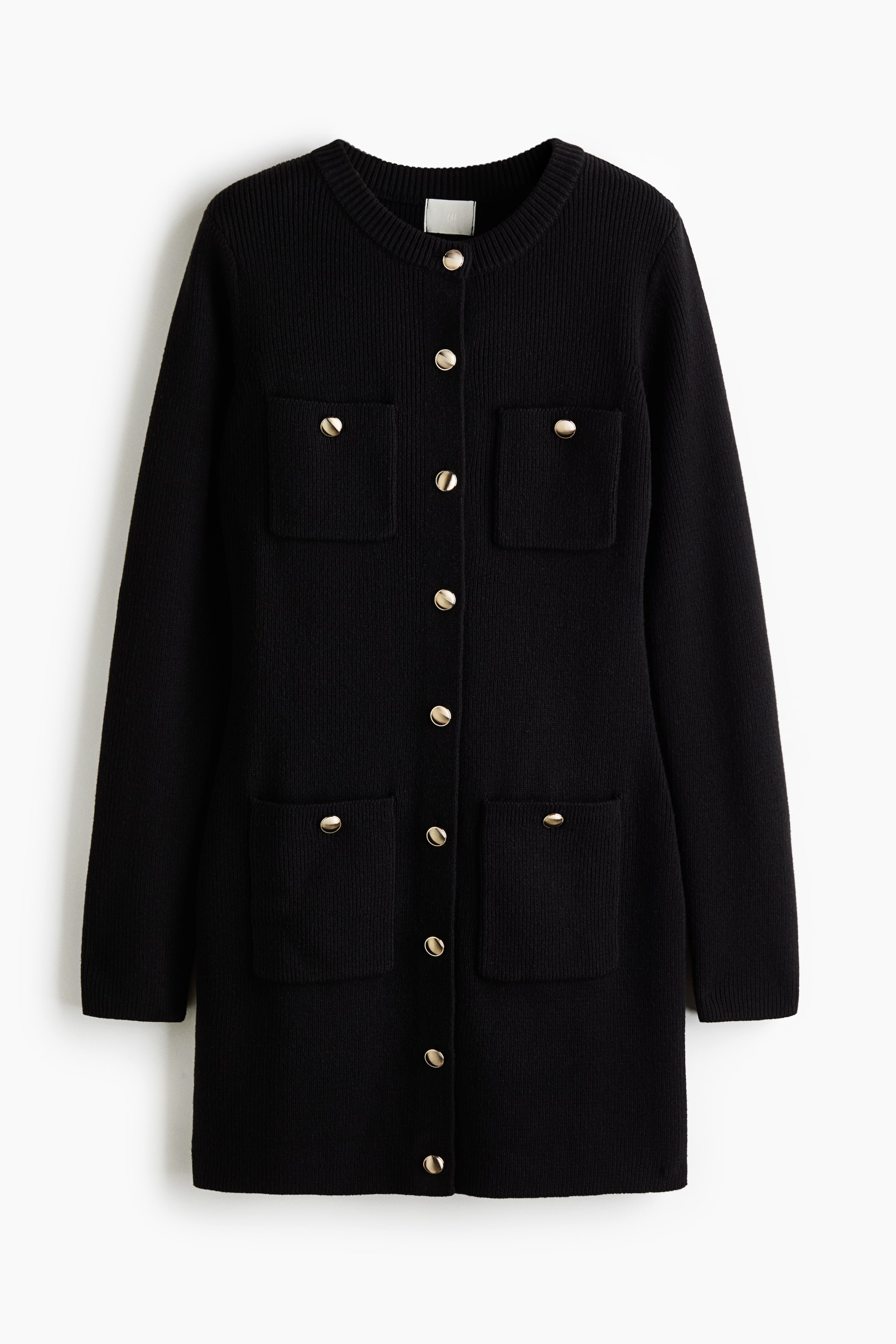 View larger image: A black, long-sleeved knitted cardigan dress is shown from the front, featuring a round, ribbed neckline and a central row of gold-tone dome buttons. The dress is designed with four front patch pockets, two on the chest and two on the lower front, each accented with a matching gold-tone button.