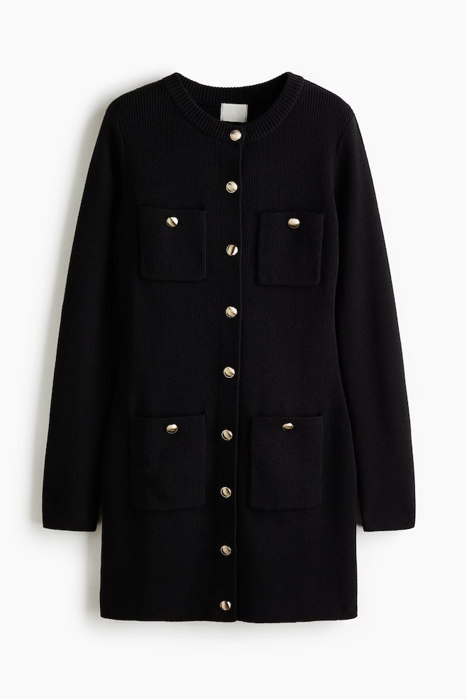 A black, long-sleeved knitted cardigan dress is shown from the front, featuring a round, ribbed neckline and a central row of gold-tone dome buttons. The dress is designed with four front patch pockets, two on the chest and two at the lower front, each accented with a matching gold-tone button. - 1