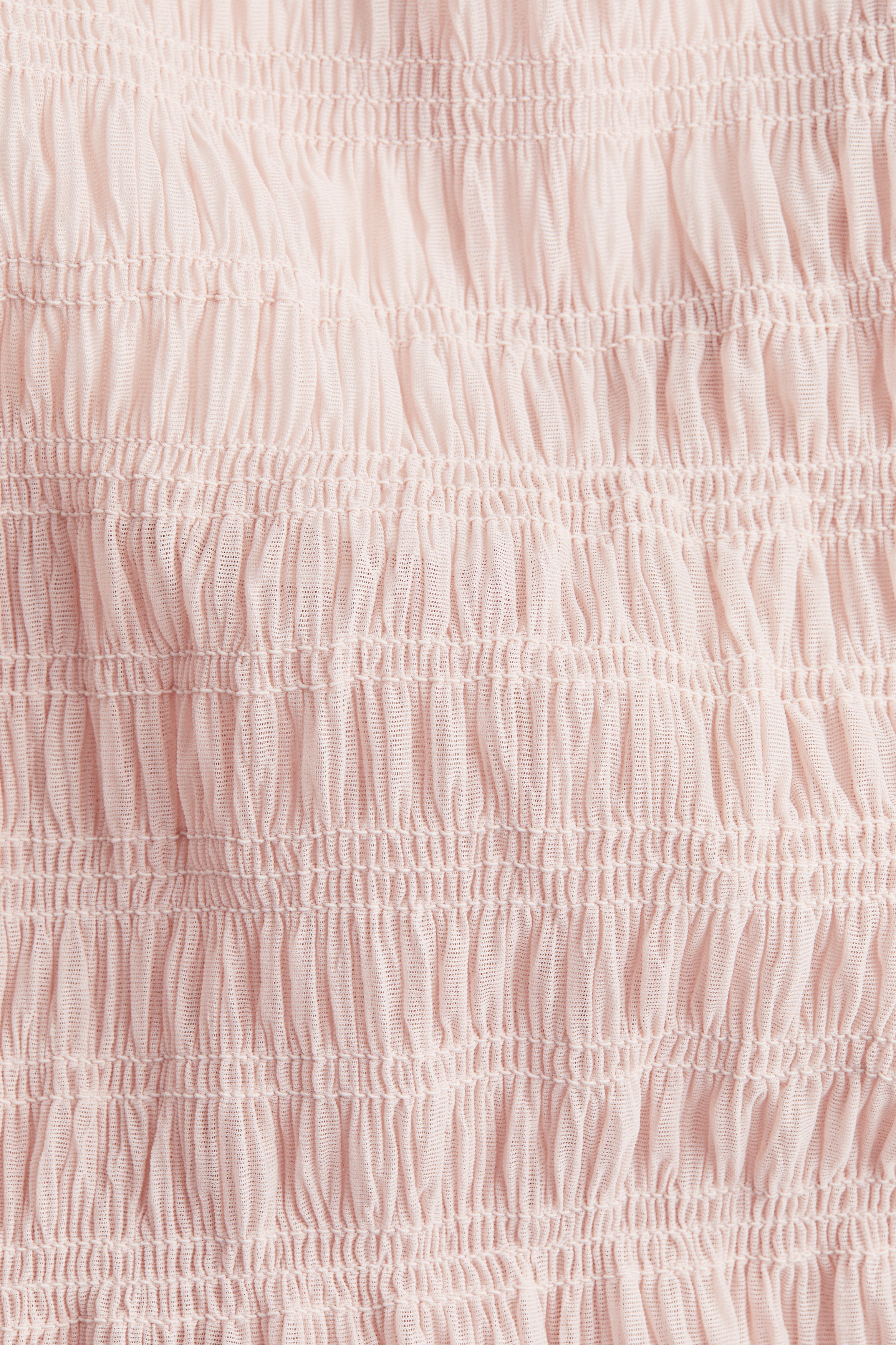 Smocked peplum top