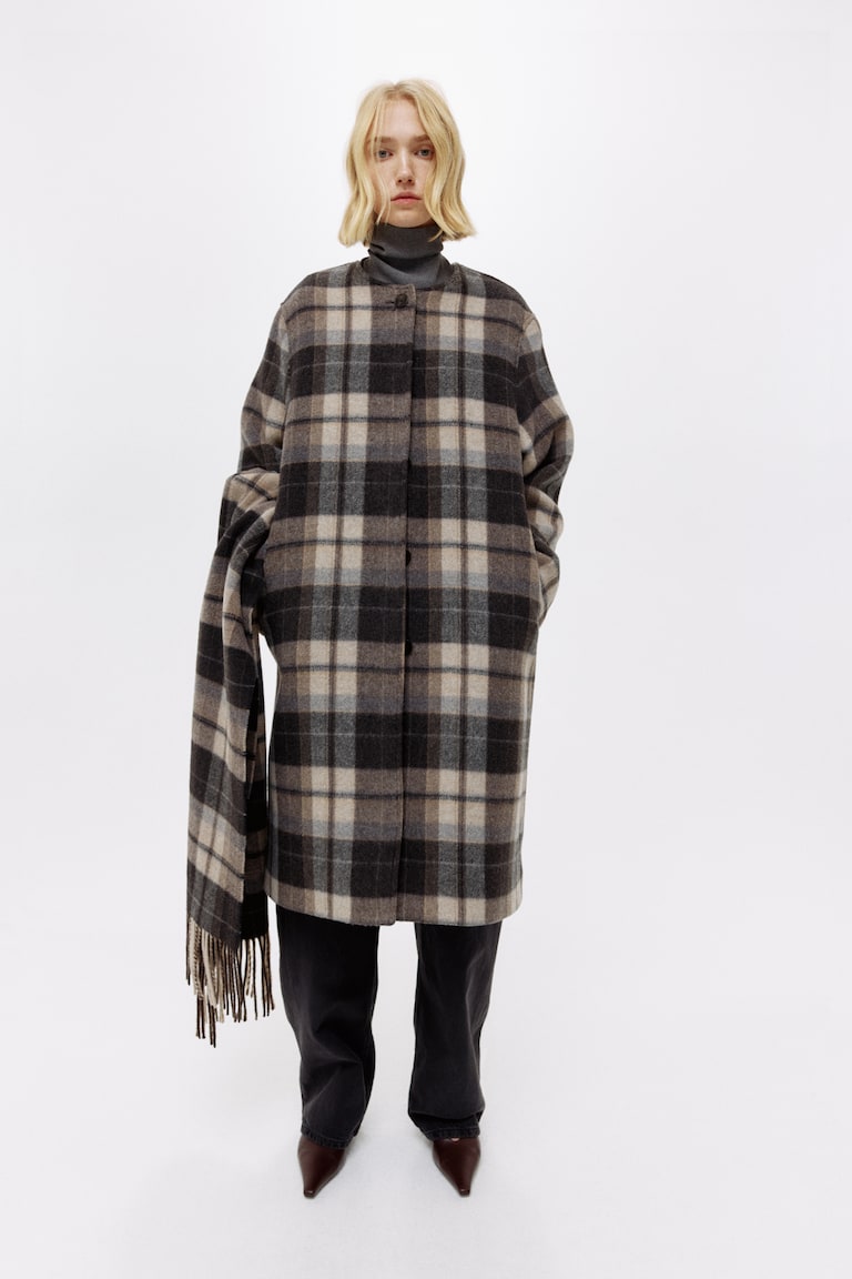 A Long Coat Without Sleeves That Fastens around Your Neck: Chic & Cozy Style