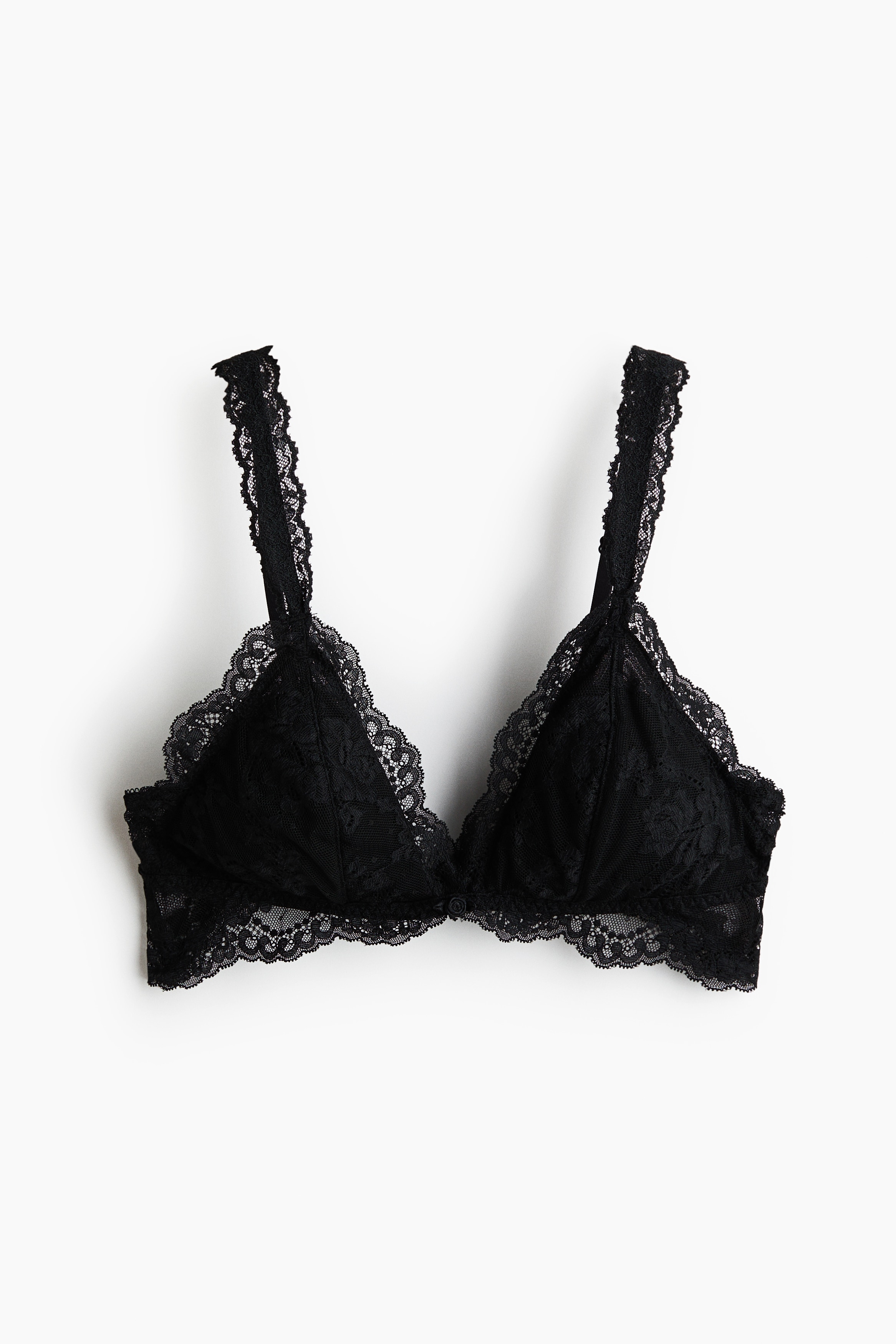 A black lace non-wired bra with triangle cups and scalloped trim is being worn by the model. The bra features lace-covered straps and is styled with matching black lace briefs.