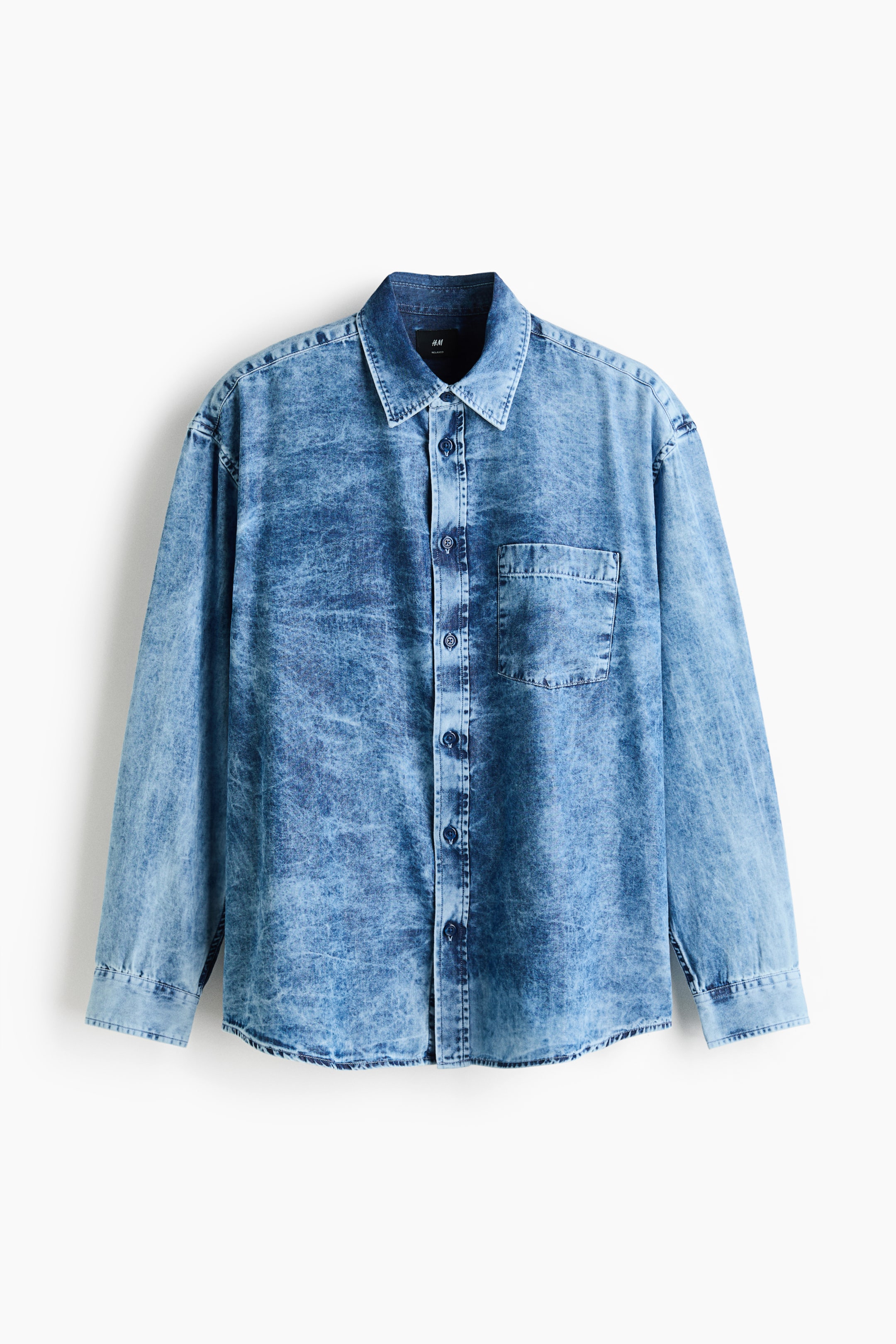 View larger image: A blue stone-washed denim shirt is showcasing its front, featuring a pointed collar and a full button-up placket. It also highlights a single chest patch pocket and long sleeves with buttoned cuffs.