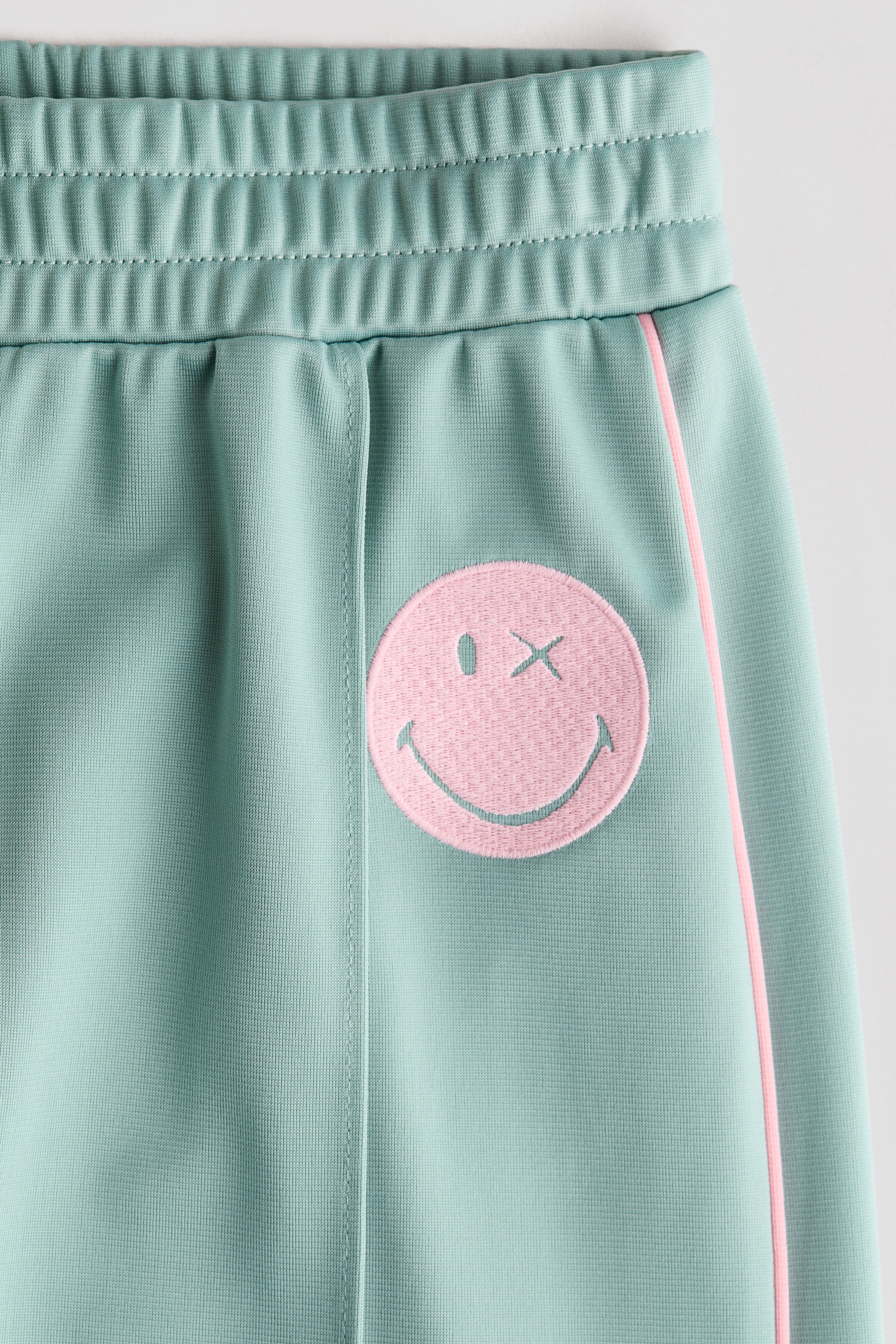 View larger image: Wide-leg track pants - Light green/SmileyWorld® - Kids | H&M GB 5