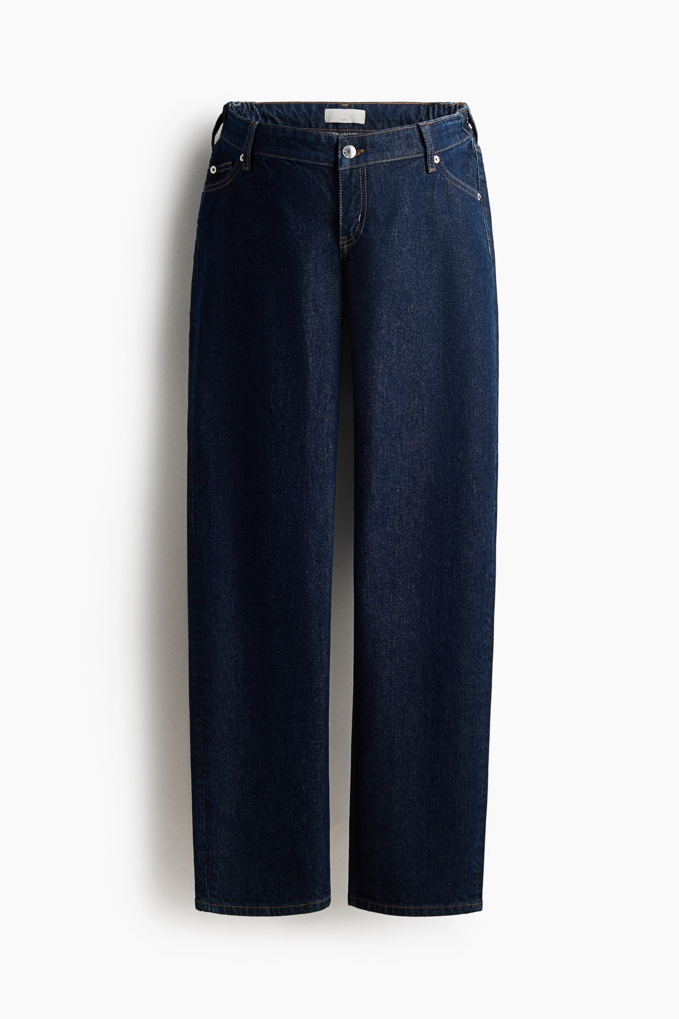 View larger image: Dark blue denim jeans are shown from the front, featuring a button and zipper closure, front pockets with metal rivets, and an elasticated back waistband. The wide-leg jeans display light brown contrast stitching.