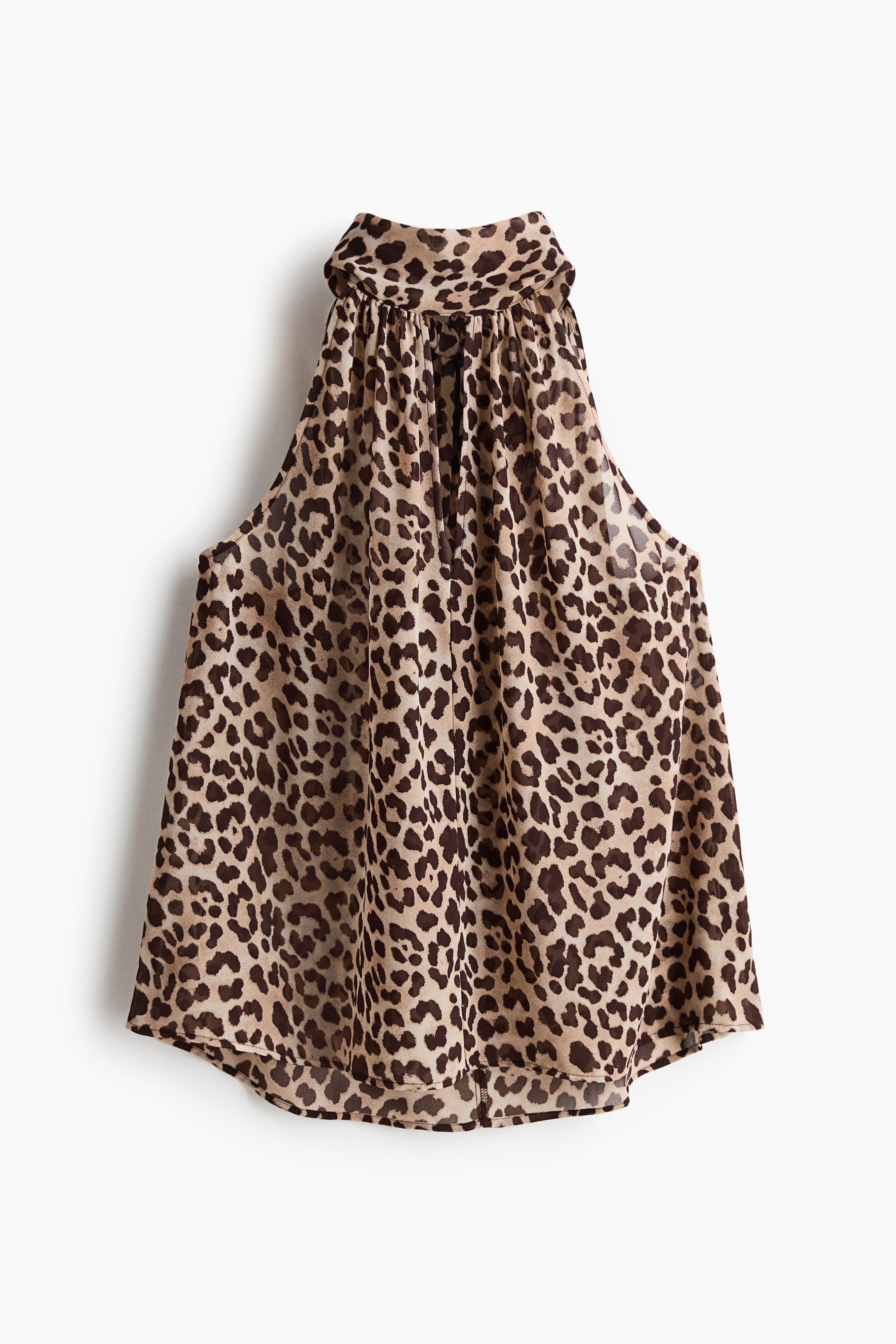 View larger image: A loose-fit top is featured from the front, highlighting a leopard print on sheer, crinkled chiffon. It is crafted with a gathered scarf collar and a V-shaped opening at the front.