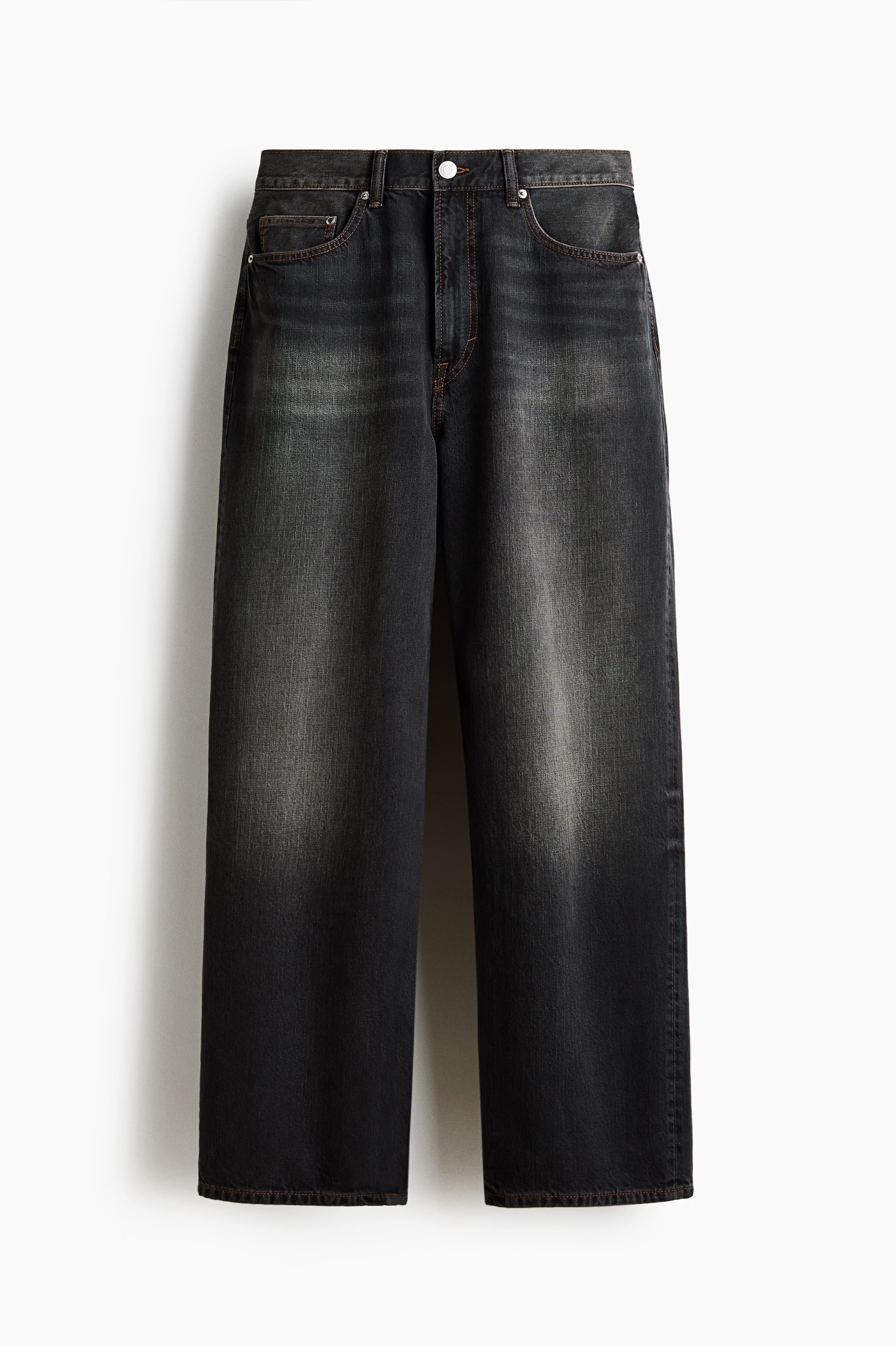 View larger image: A pair of 5-pocket jeans is showcased from the front in a faded dark gray rigid denim. These jeans feature a regular waist, a zip fly, and a baggy fit with rounded legs, appearing wide from the seat to the hem and designed to stack at the ankle.