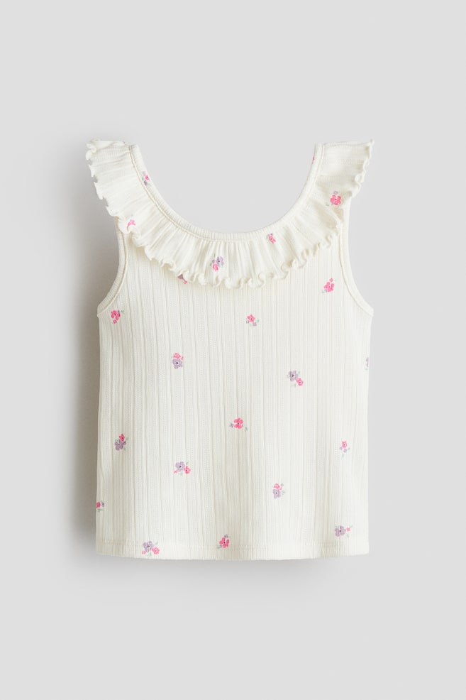 Top sin mangas en pointelle con olanes - Crema/Floreado/Morado/Floreado - 1