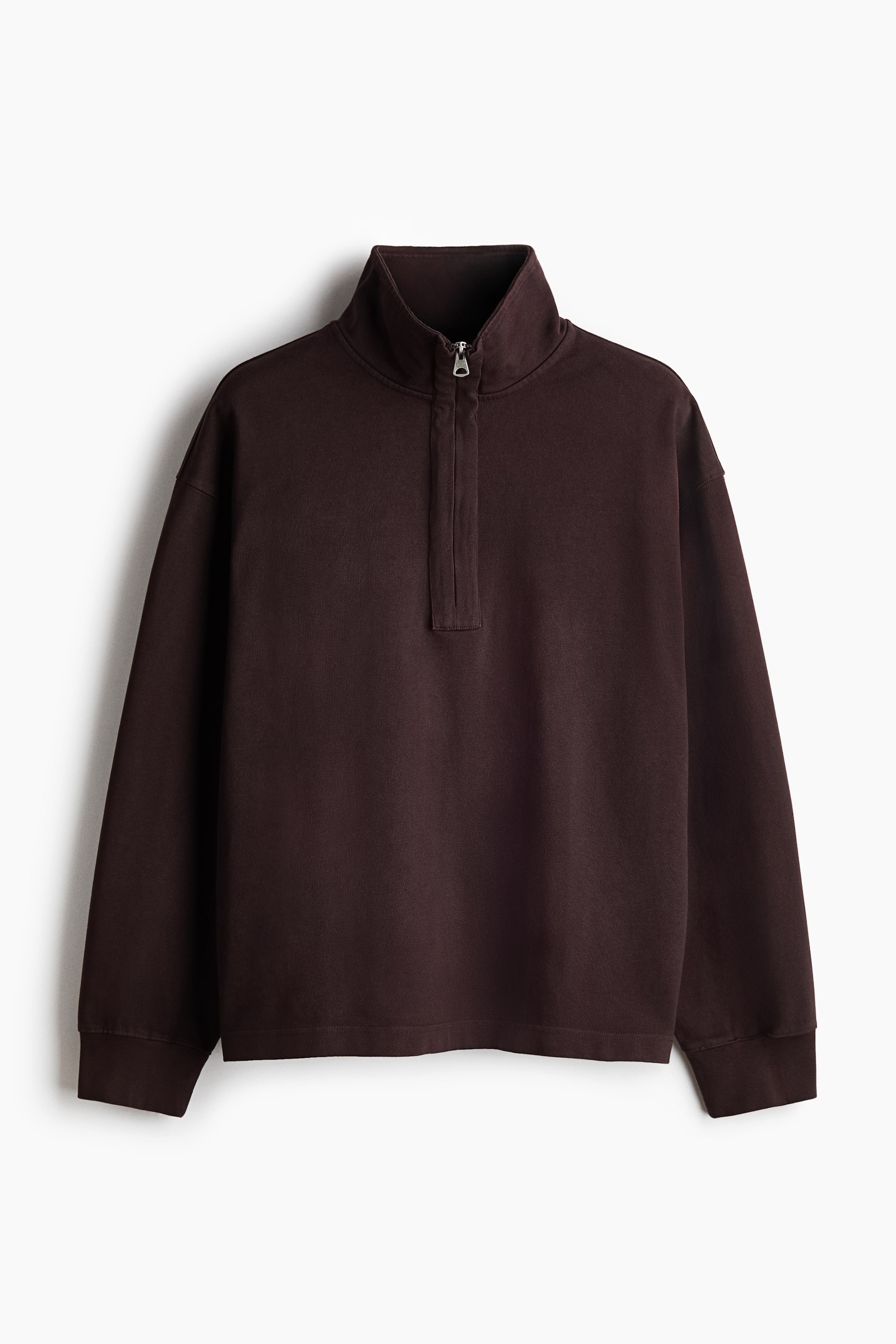 View larger image: A dark brown quarter-zip sweatshirt is shown in a front view. It features a high collar with a partially unzipped silver-toned zipper extending down a central placket, and is finished with long sleeves and a straight bottom hem.