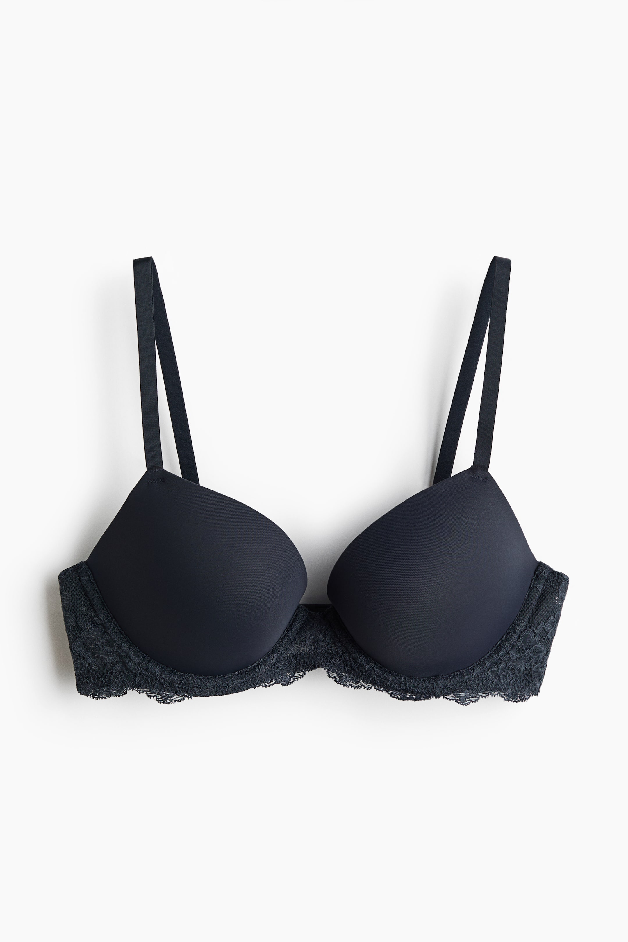 View larger image: The front view of a black push-up bra is showcased, highlighting its smooth microfiber cups and elegant lace trim that runs along the bottom edge of the cups and extends to the side bands. Adjustable shoulder straps are visible at the top.
