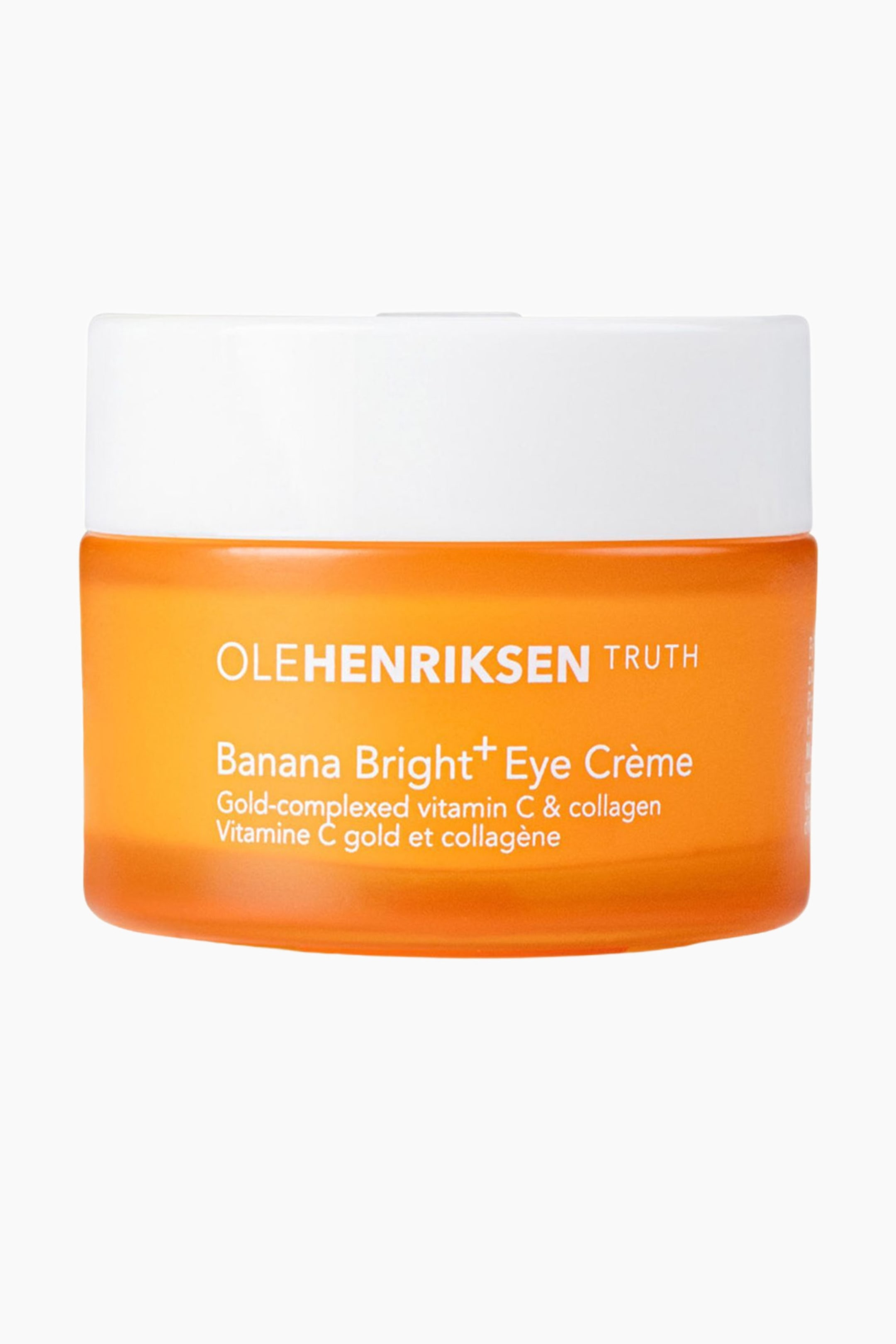 Se større billede: En cylindrisk øjencremekrukke står oprejst og vender fremad med en gennemskinnelig orange beholder og et uigennemsigtigt hvidt låg. Forsiden af krukken viser "OLEHENRIKSEN TRUTH Banana Bright? Eye Cr�me Gold-complexed vitamin C & collagen Vitamine C gold et collag�ne" i hvid tekst.